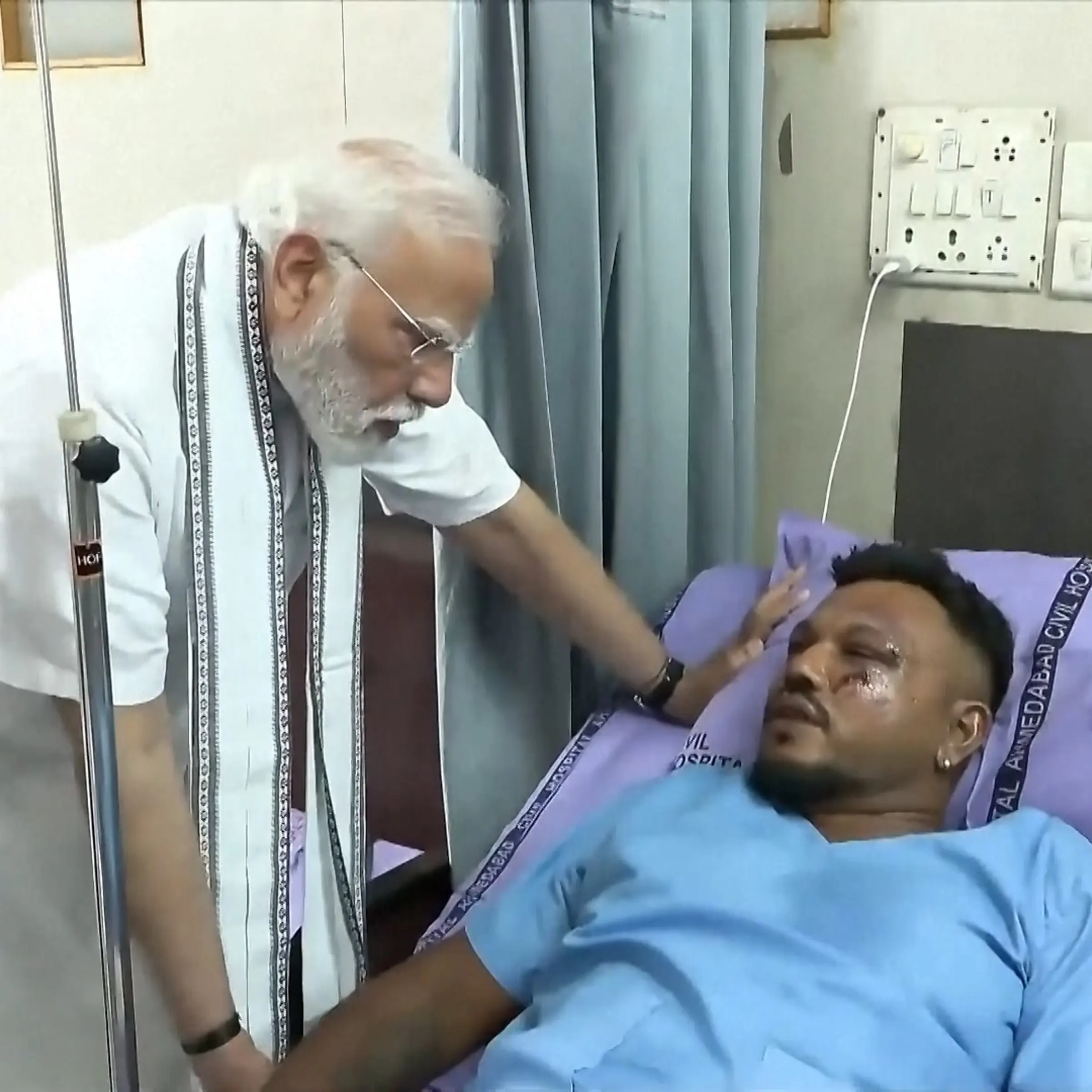 Indian Prime Minister Narendra Modi meets with Viswashkumar Ramesh, the sole survivor of the Air India crash.