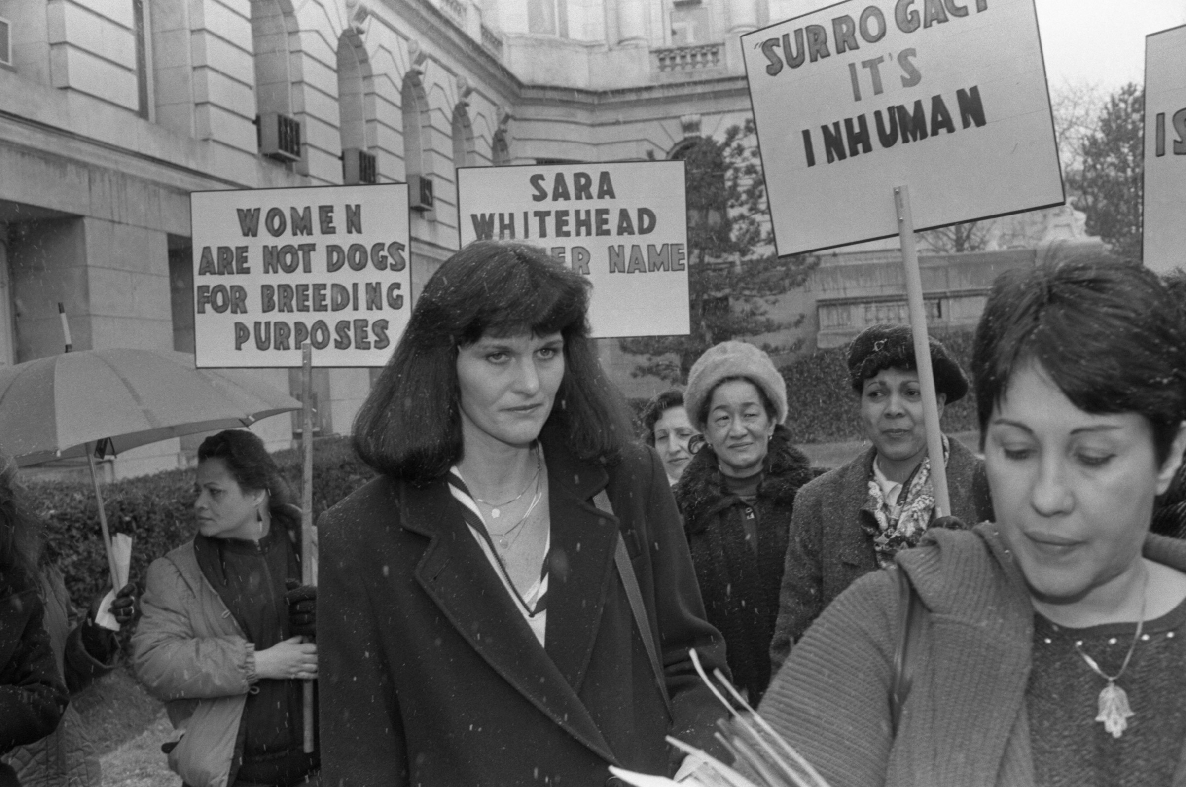Surrogate mother Mary Beth Whitehead joins a group of women demonstrating on her behalf outside Bergen County courthouse on March 12, 1987, after the lawyers in the "Baby M" custody case delivered their summations.