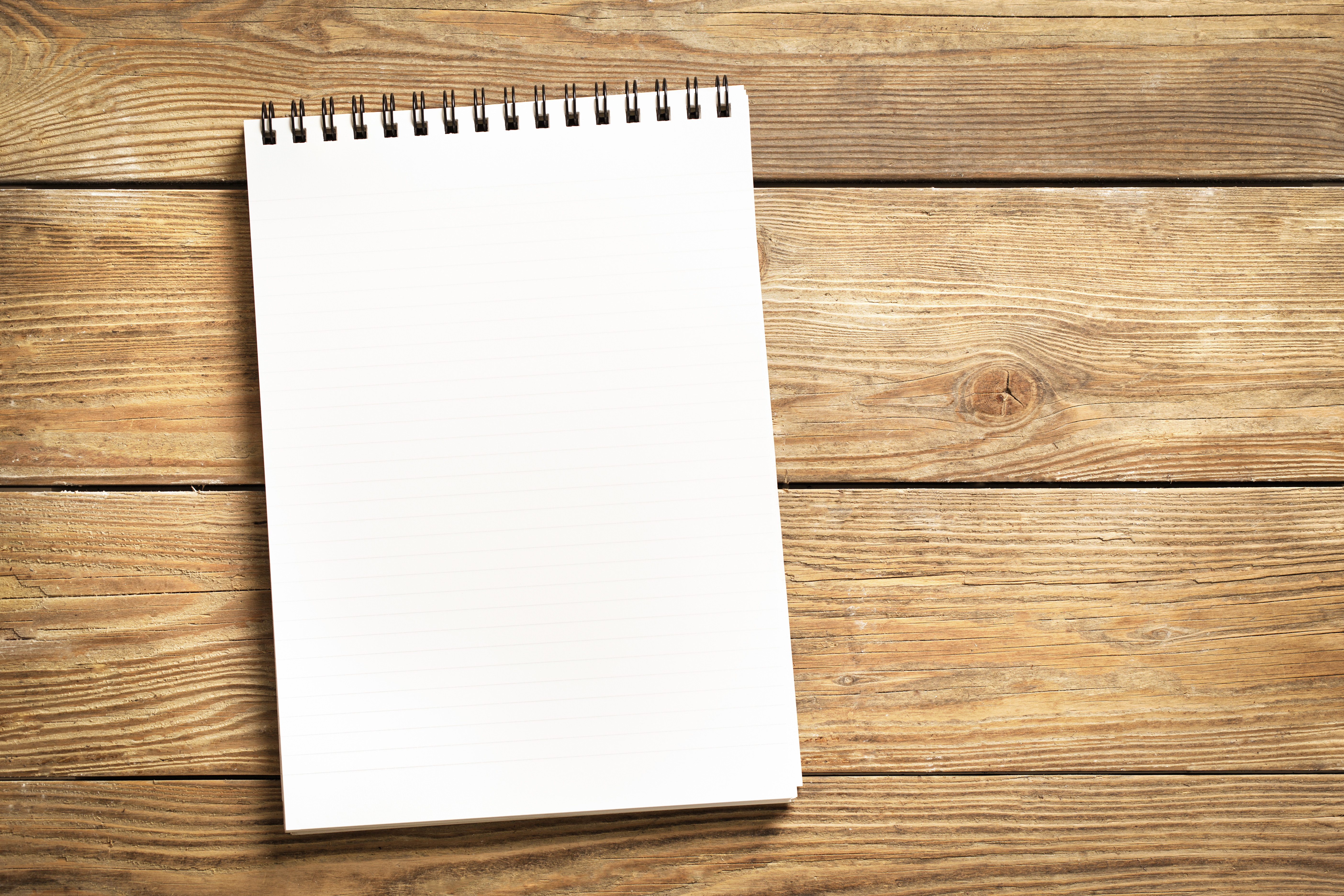 notepad-wooden-surface