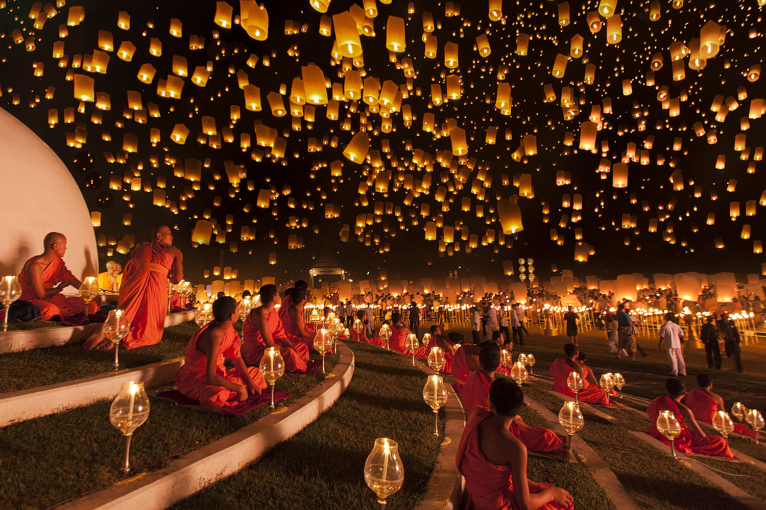 Ng Chai Hock: "Monks look up at a magnificent night sky filled with thousands of lanterns during the Yi Peng lantern festival. This was the moment I'd been waiting for and it passed very quickly due to strong wind. A very heavy downpour occurred right af