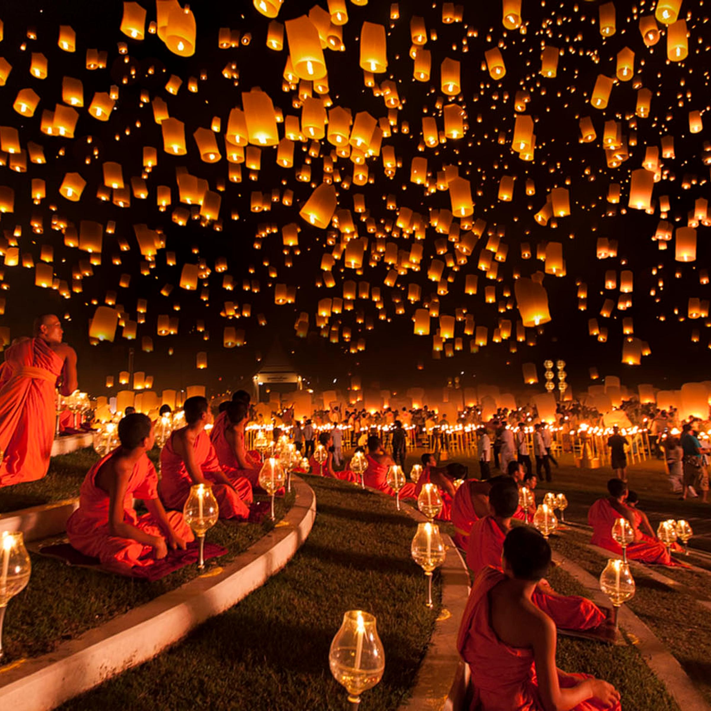 Ng Chai Hock: "Monks look up at a magnificent night sky filled with thousands of lanterns during the Yi Peng lantern festival. This was the moment I'd been waiting for and it passed very quickly due to strong wind. A very heavy downpour occurred right af