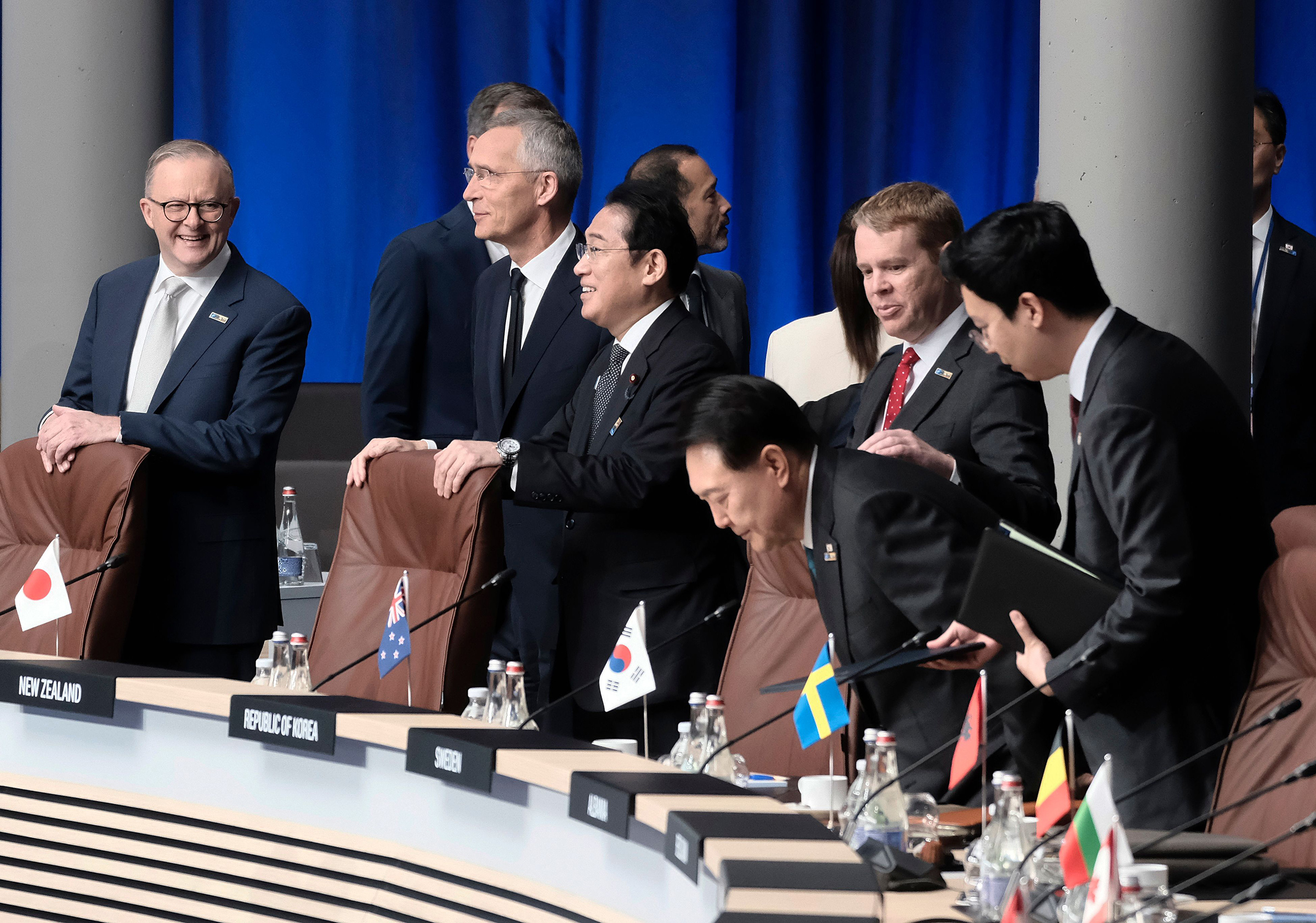 Japan's Prime Minister Fumio Kishida and South Korean President Yoon Suk Yeol attend the North Atlantic Council meeting alongside Australian Prime Minister Anthony Albanese, NATO Secretary General Jens Stoltenberg, and Prime Minister of New Zealand Chris Hipkins at the NATO summit in Vilnius, Lithuania, on July 12.