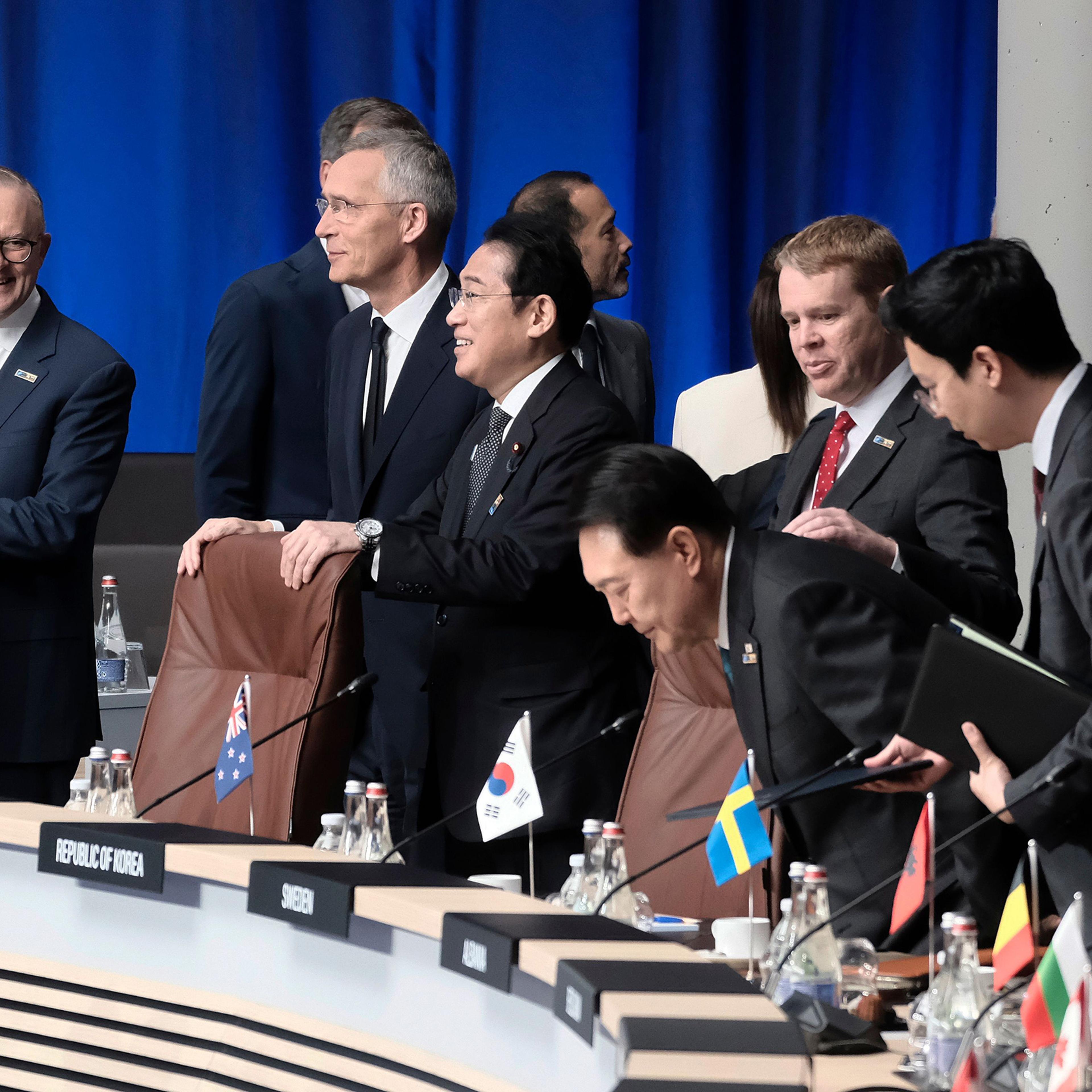 Japan's Prime Minister Fumio Kishida and South Korean President Yoon Suk Yeol attend the North Atlantic Council meeting alongside Australian Prime Minister Anthony Albanese, NATO Secretary General Jens Stoltenberg, and Prime Minister of New Zealand Chris Hipkins at the NATO summit in Vilnius, Lithuania, on July 12.