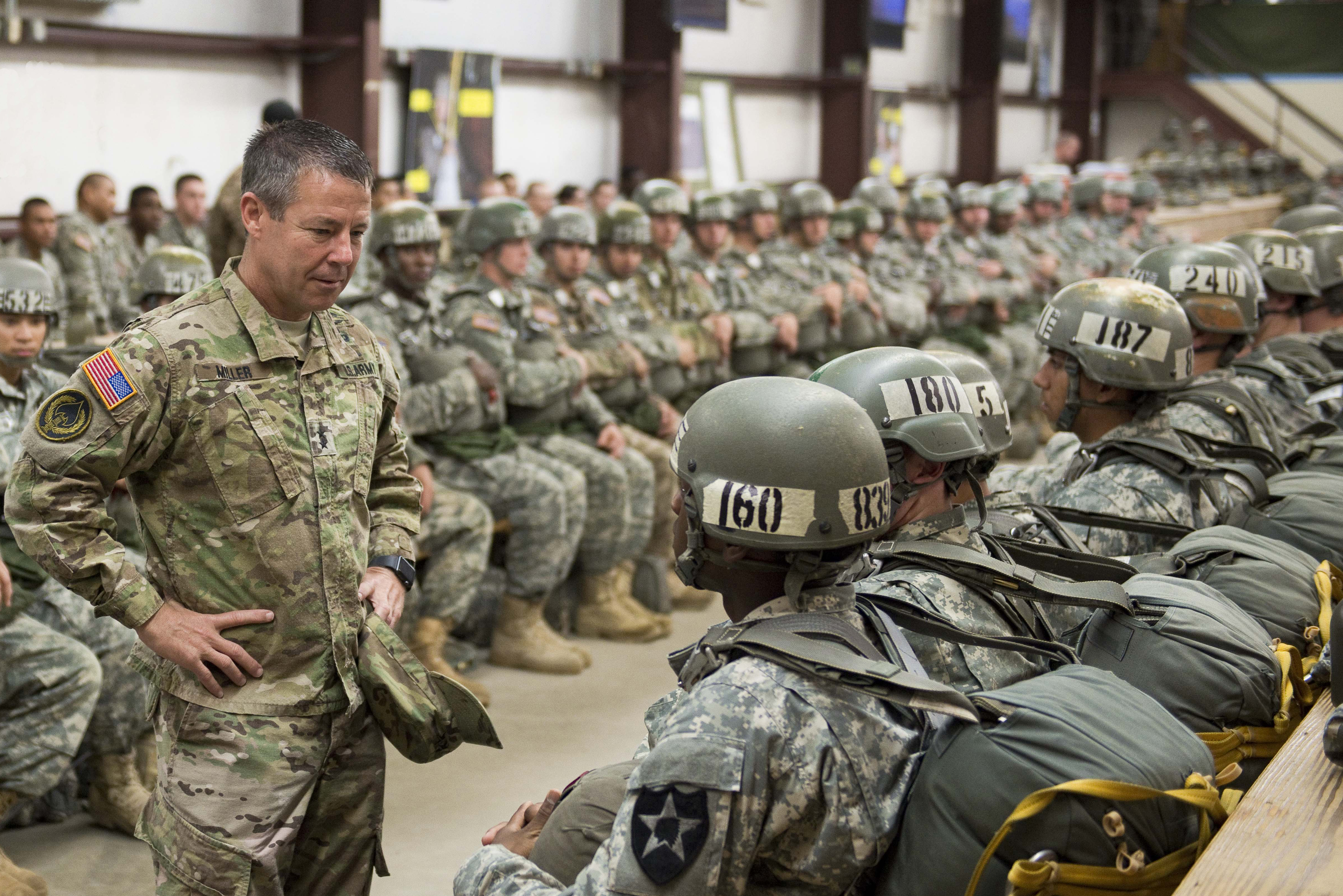 Lt. Gen. Scott Miller, then-commanding general of Fort Benning and the Maneuver Center of Excellence, talks with soldiers before one of the Airborne School jumps in 2015.