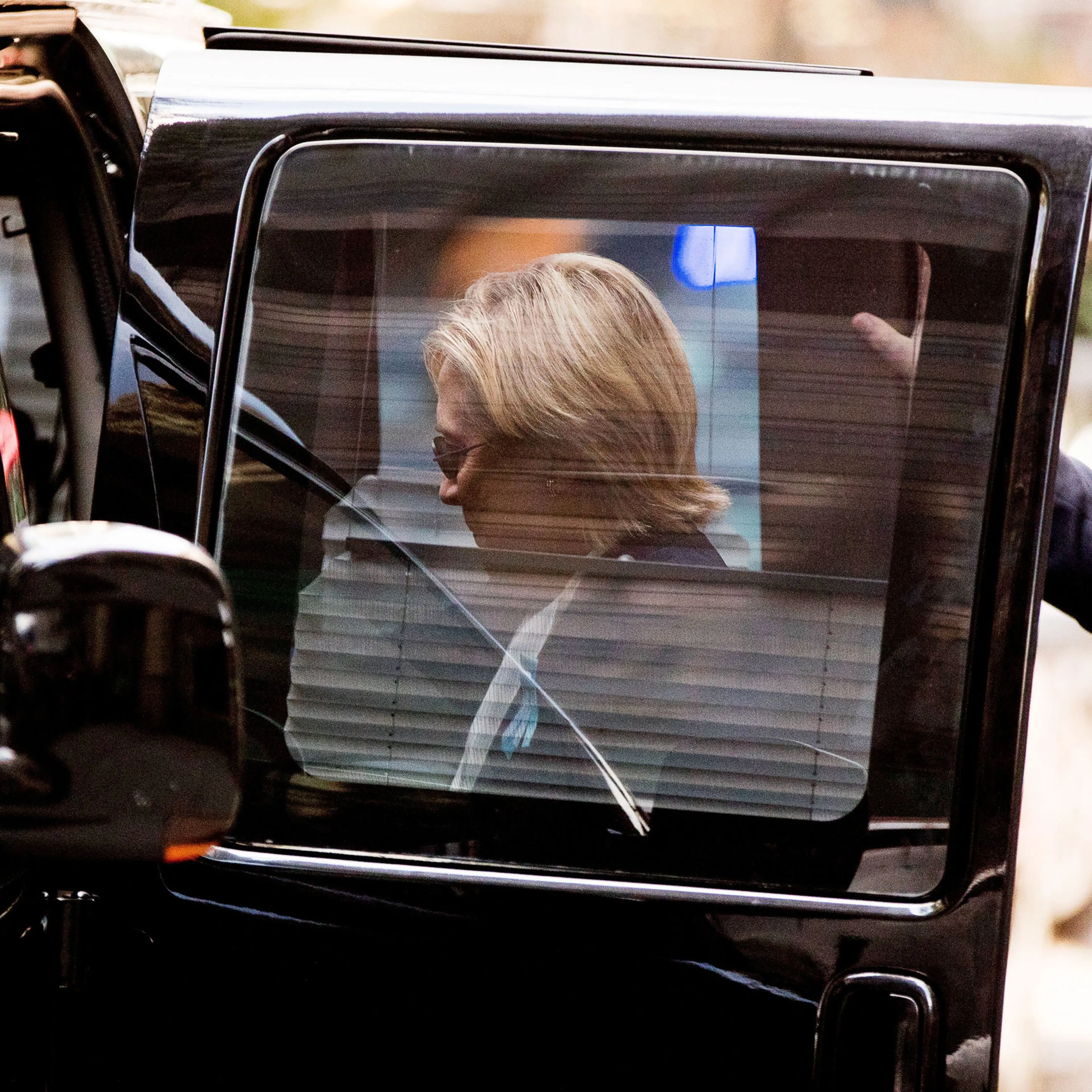 Clinton returns to her motorcade after briefly recuperating at her daughter Chelsea’s apartment