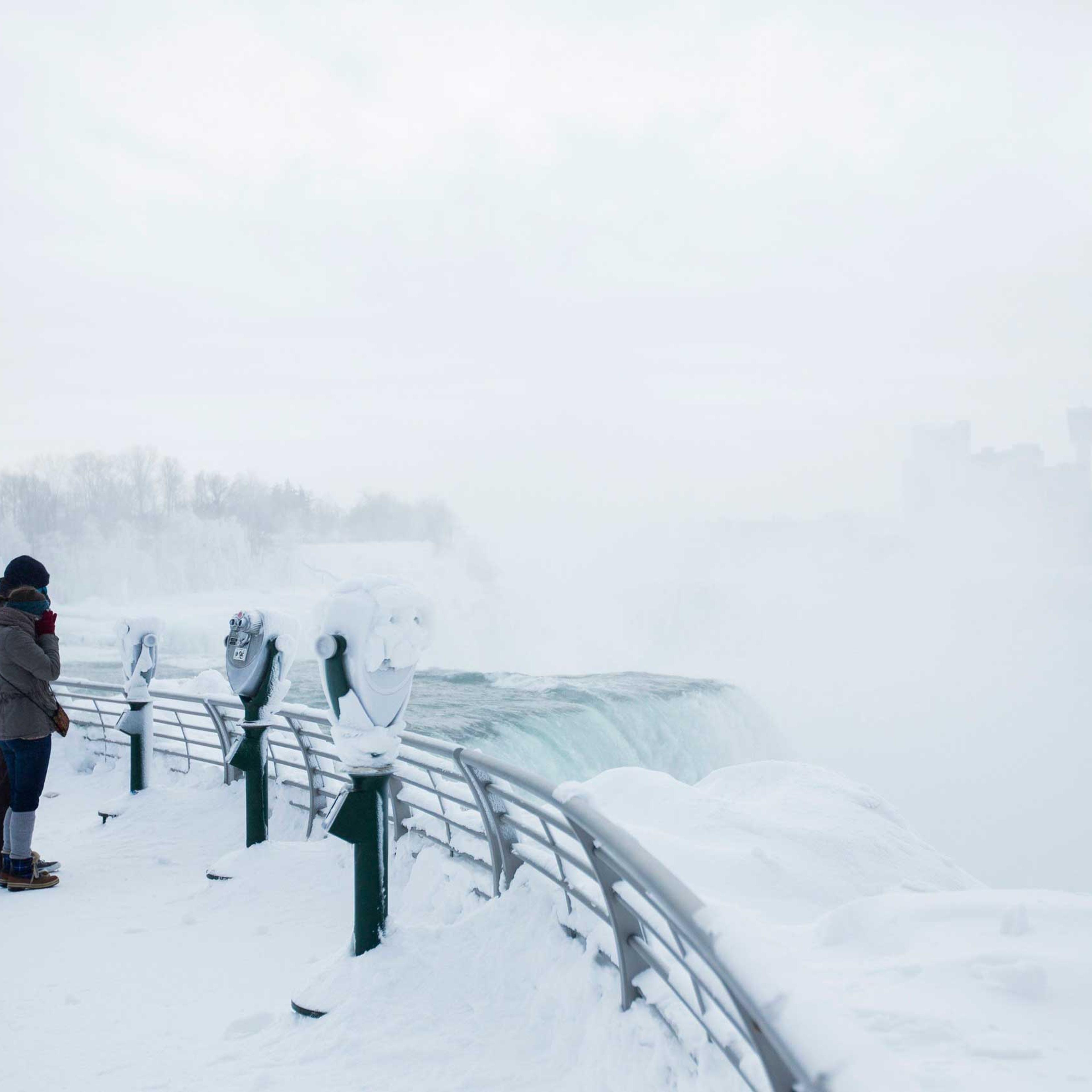 Visitors view frozen Niagara Falls in Niagara Falls, New York, Feb. 17, 2015.