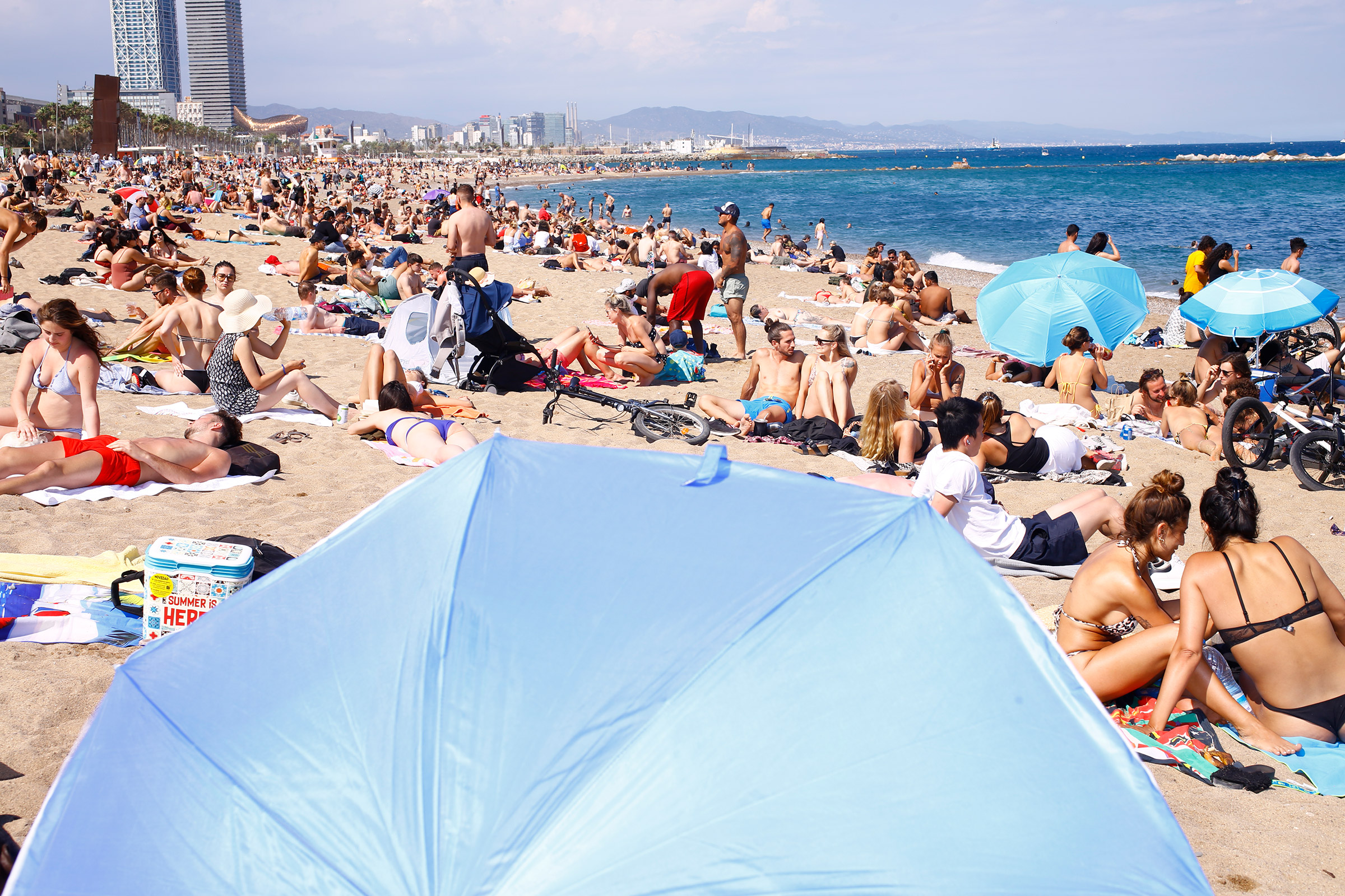 Sunbathers enjoy the busy Barceloneta Beach on June 6, 2021.