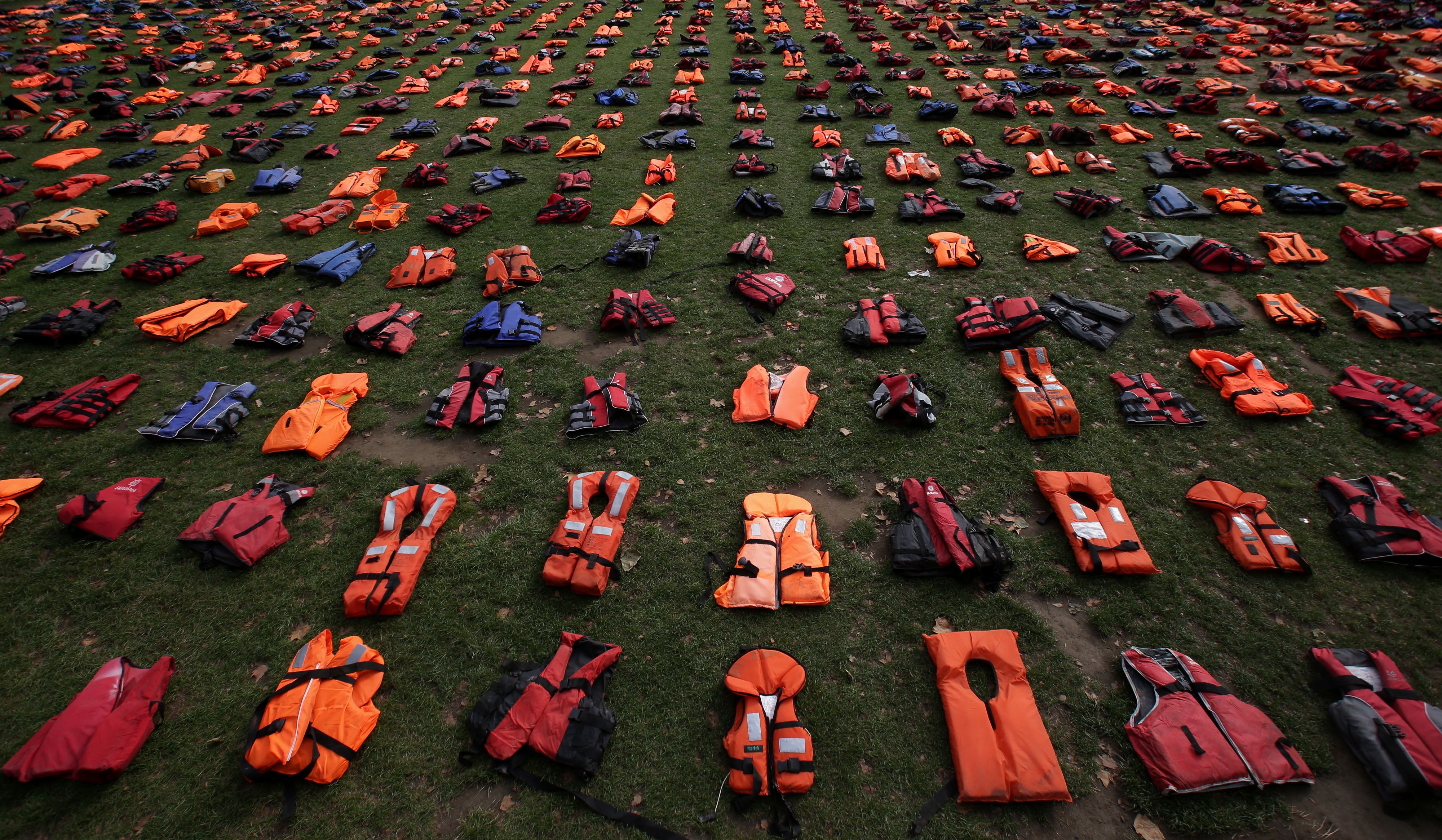 2,500 lifejackets, worn by refugees during crossings from Turkey to the Greek island of Chios, are displayed on Parliament Square, opposite the Houses of Parliament, in central London, on September 19, 2016, during a photcall to highlight the number of r