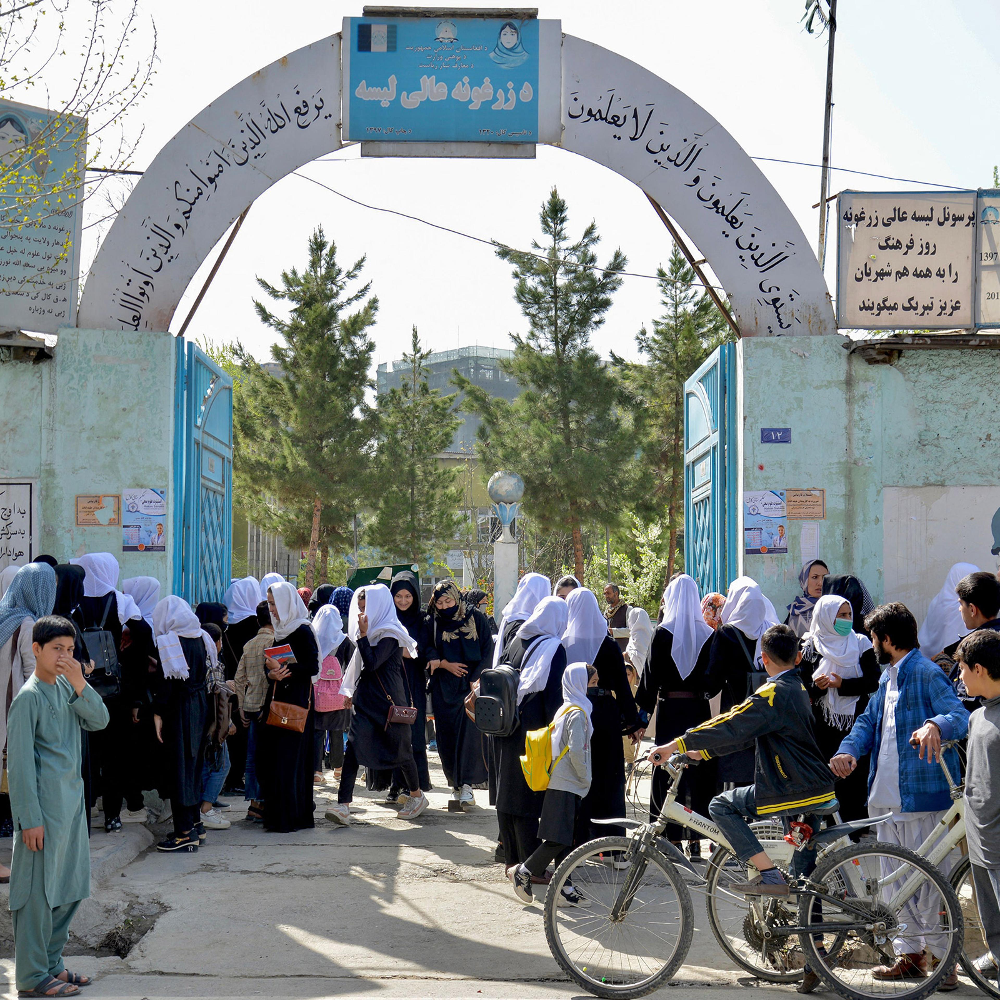 Girls leave their school following order of closure just hours after reopening in Kabul on March 23, 2022.