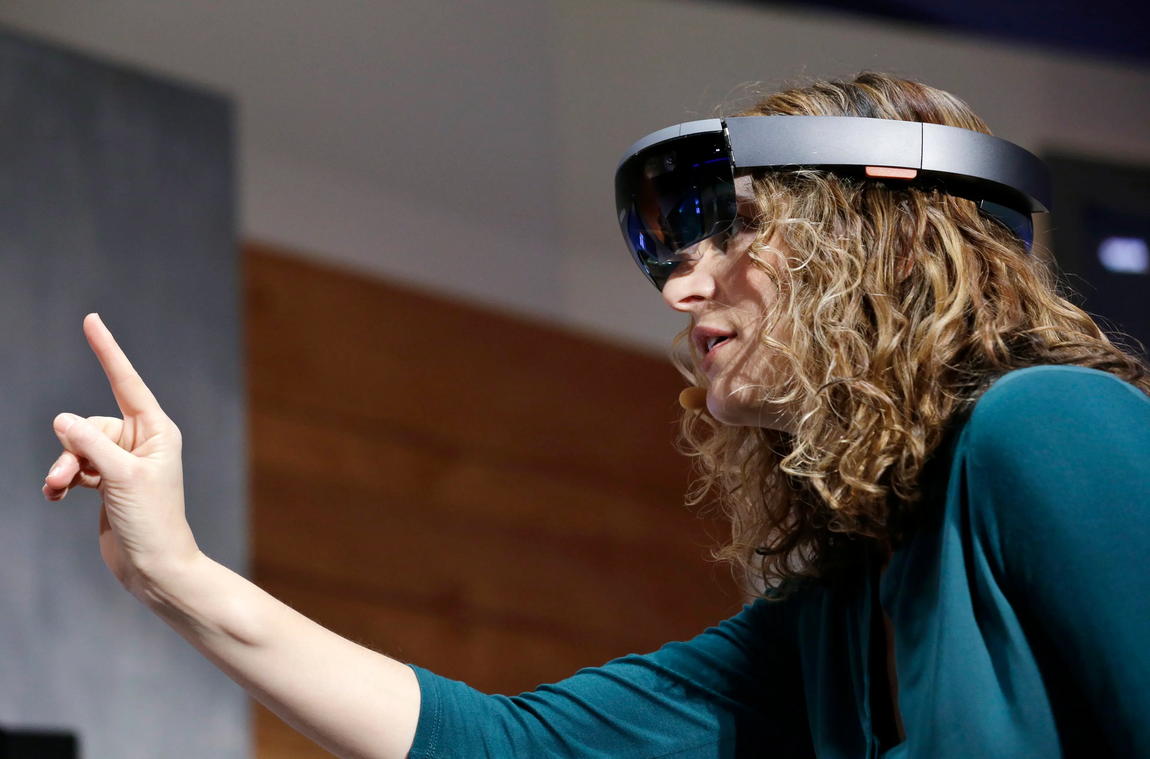 Microsoft's Lorraine Bardeen demonstrates HoloLens headset during an event at the company's headquarters in Redmond, Wash. on Jan. 21, 2015.