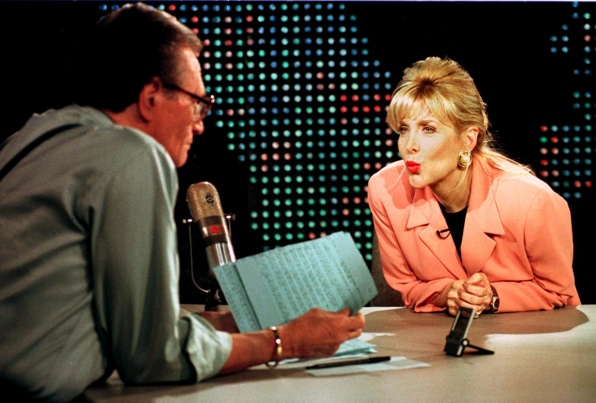 Gennifer Flowers (R) blows a kiss to talk show hos
