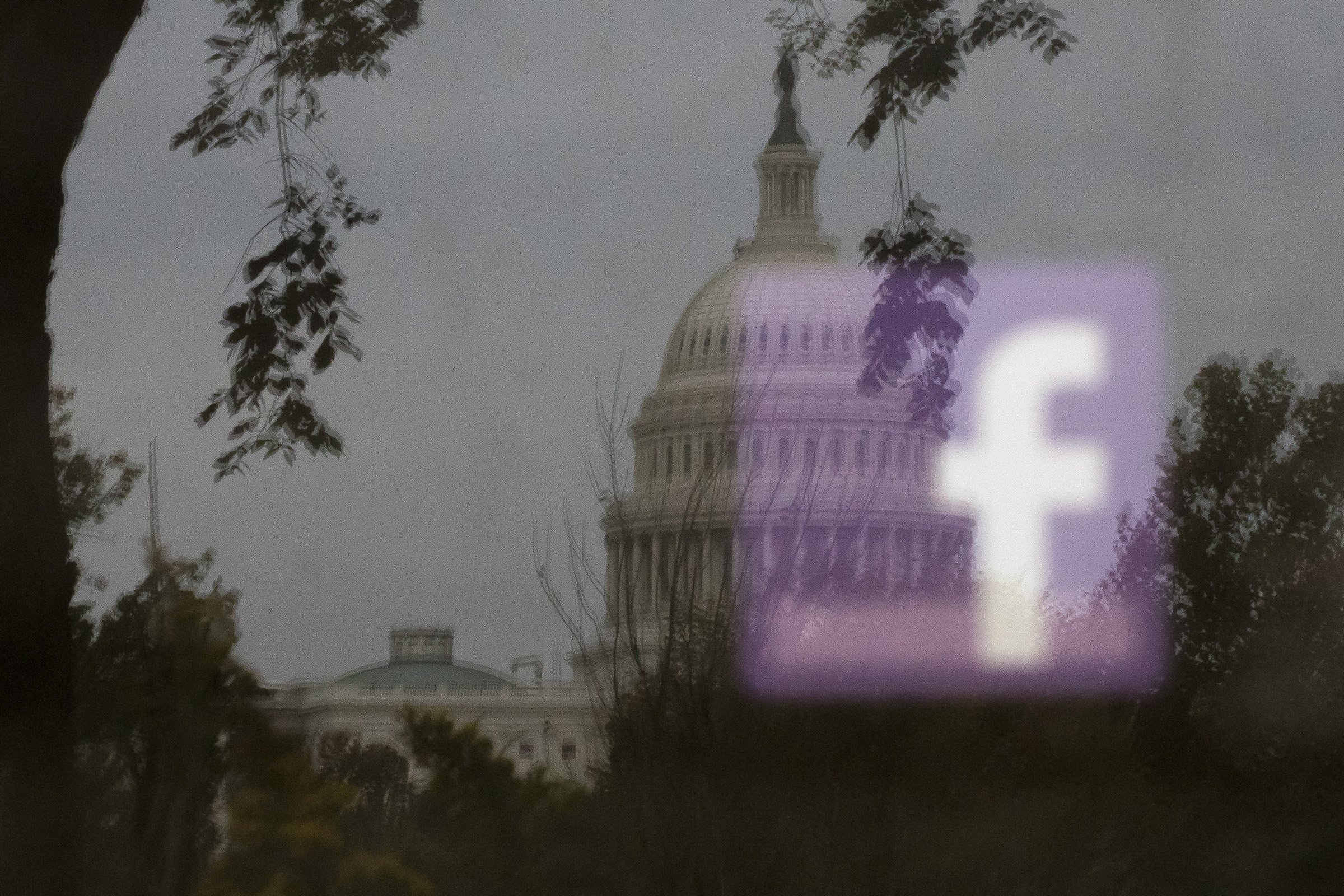A Facebook logo is reflected on an advertisement board outside the Capitol in Washington, Oct. 25, 2018. (Tom Brenner/The New York Times)