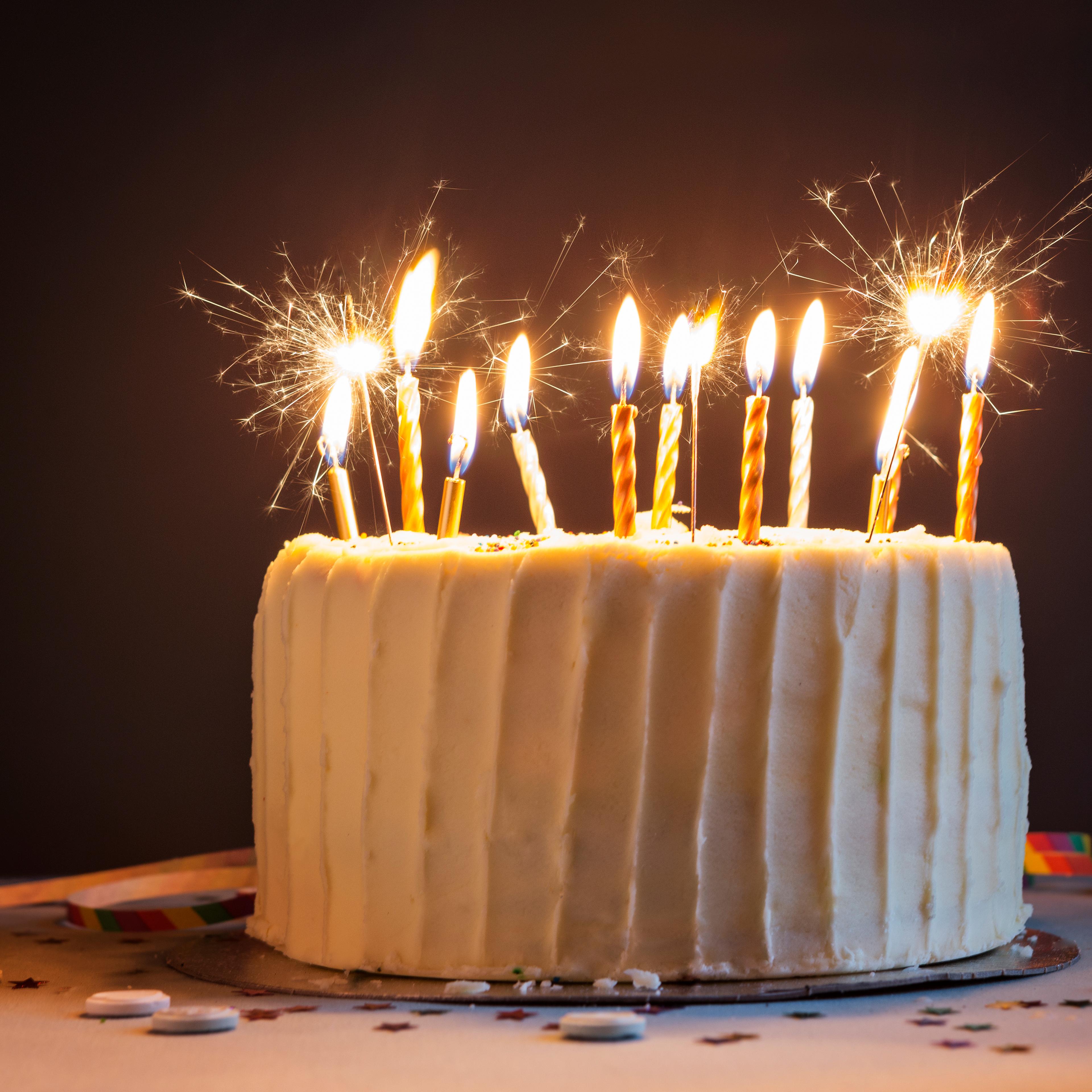 Birthday cake with candles and sparklers.