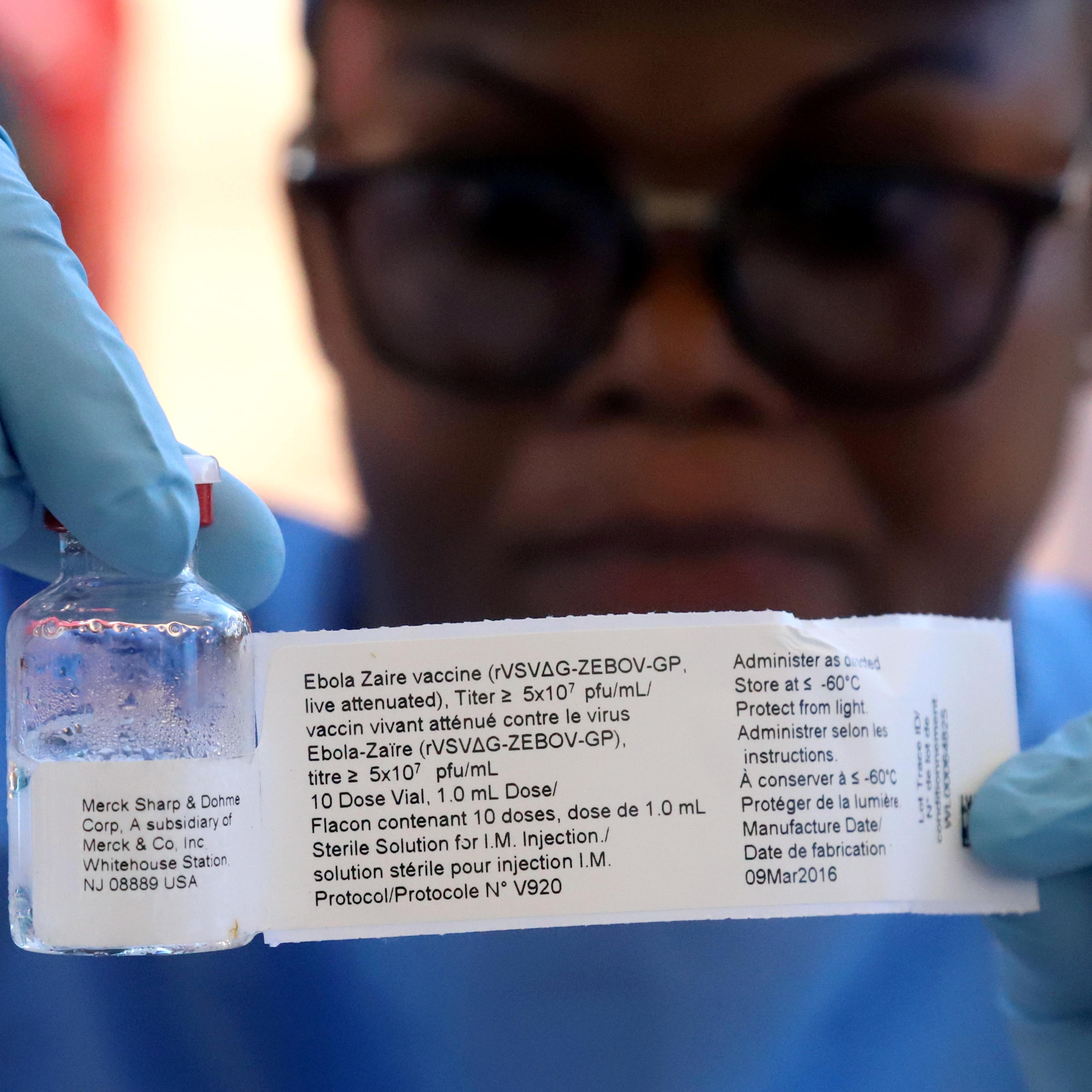 FILE PHOTO: A World Health Organization worker prepares to administer a vaccination during the launch of a campaign aimed at beating an outbreak of Ebola in the port city of Mbandaka