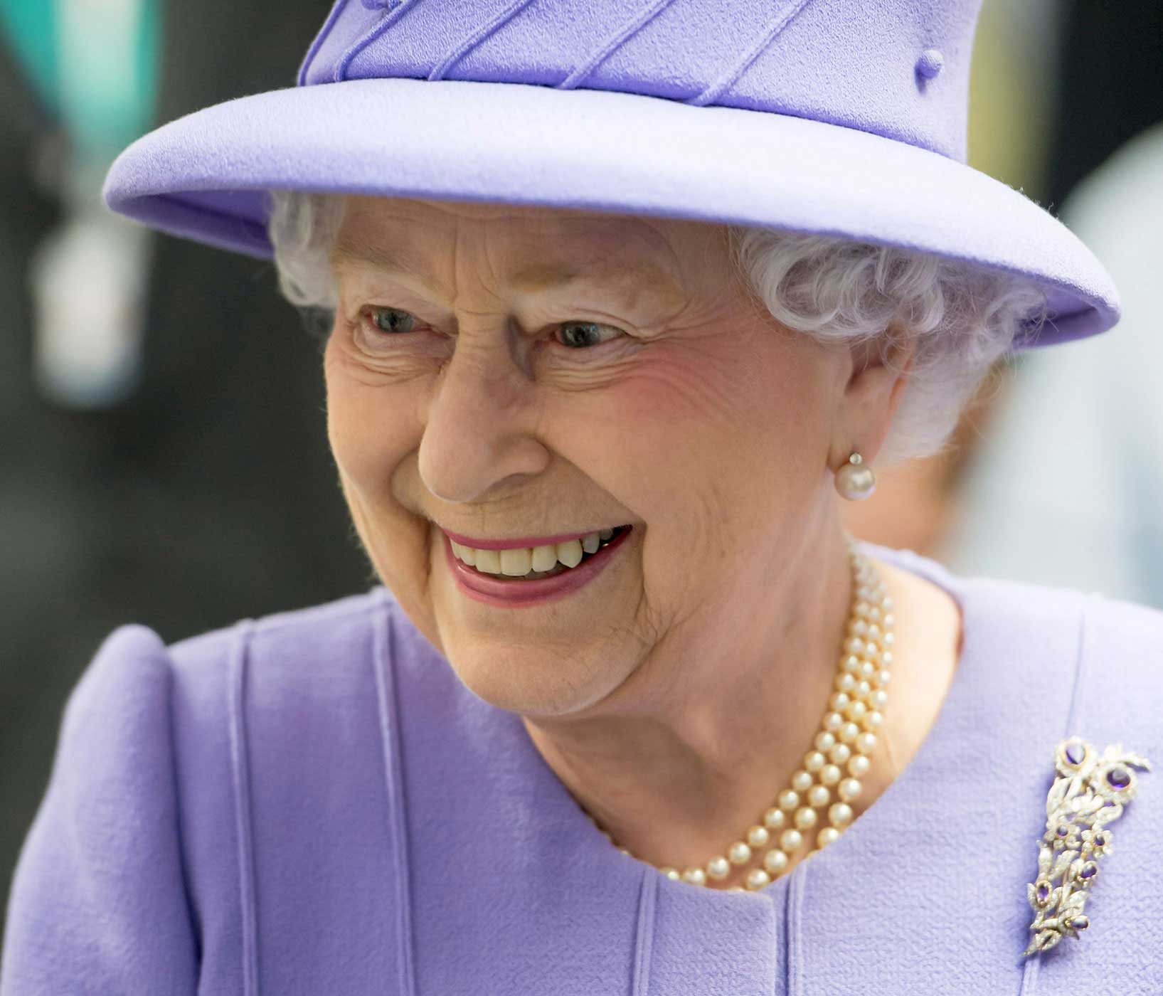 File photograph shows Britain's Queen Elizabeth touring the Royal London Hospital in east London