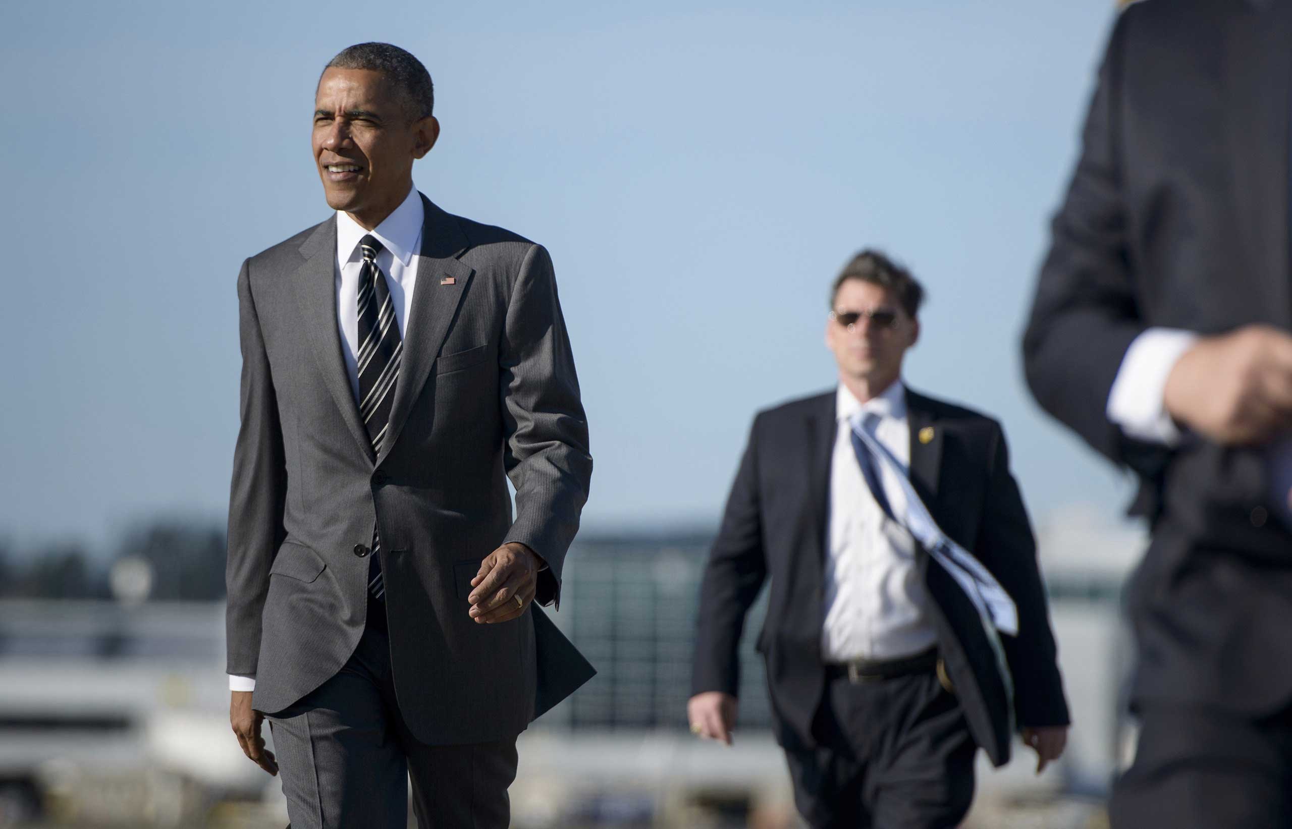President Barack Obama arrives at the Oregon Air National Guard Base ahead of a fundraiswer at Nike, in Portland on May 7, 2015.