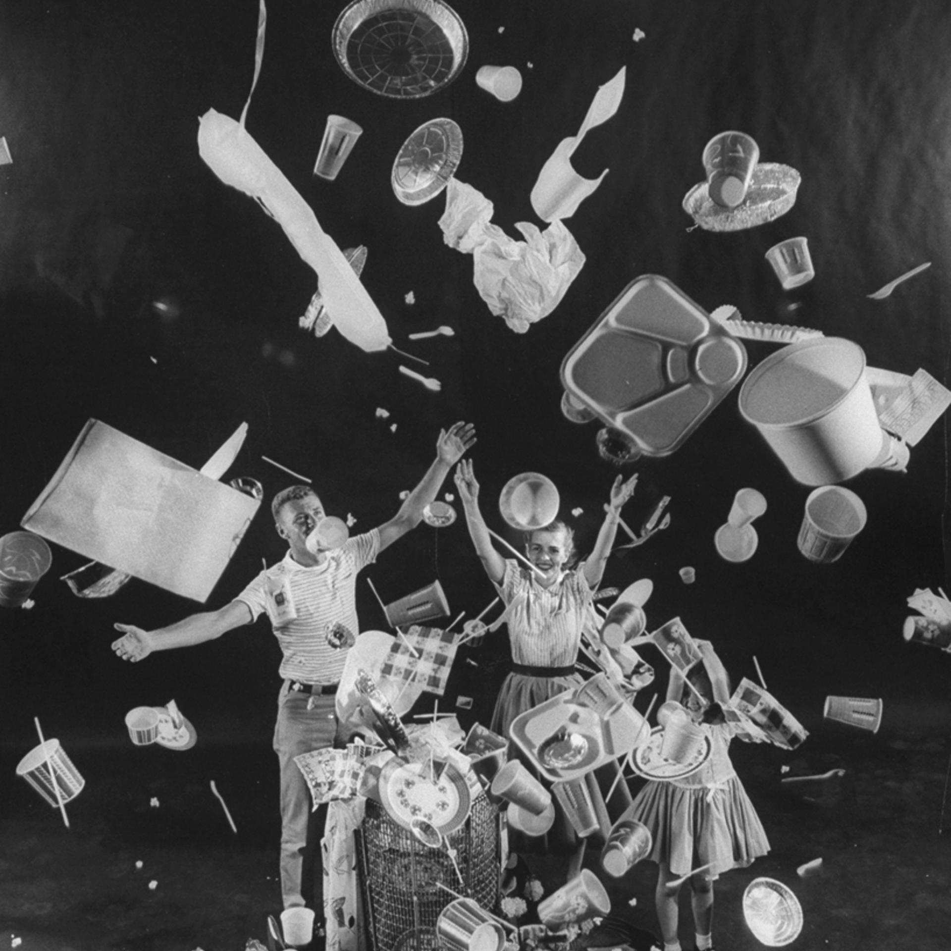 A man, woman and child toss "disposable" items into the air, 1955.