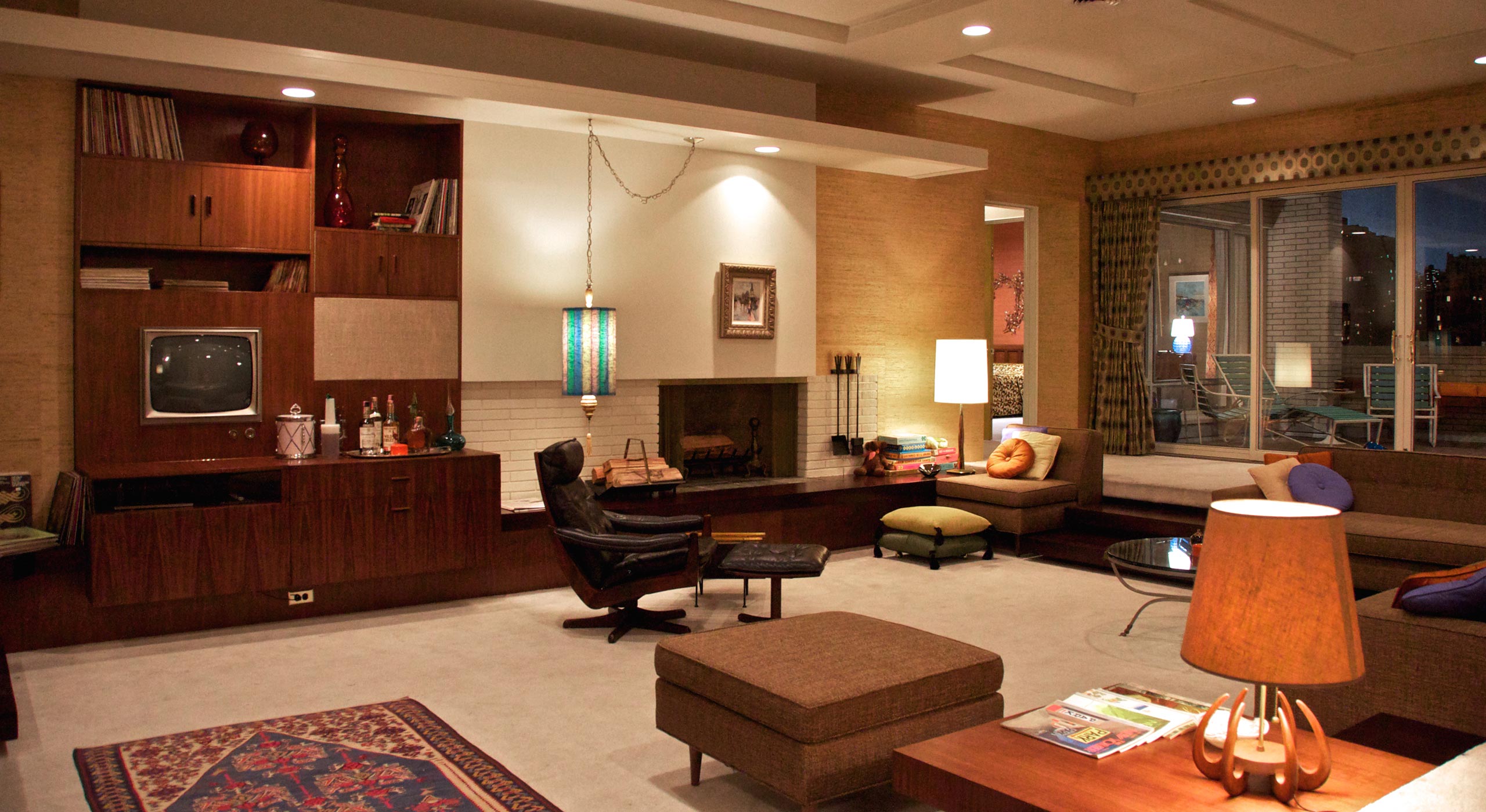 <b>Draper apartment</b> (1966, inspired by Frank Lloyd Wright): "Don's moving from suburbia—from classical and neoclassical architecture to modern...The sunken living room creates a more dynamic space for the actors. Sometimes they have to step over furniture to get into that lower level. It's fun." —Dan Bishop, set designer