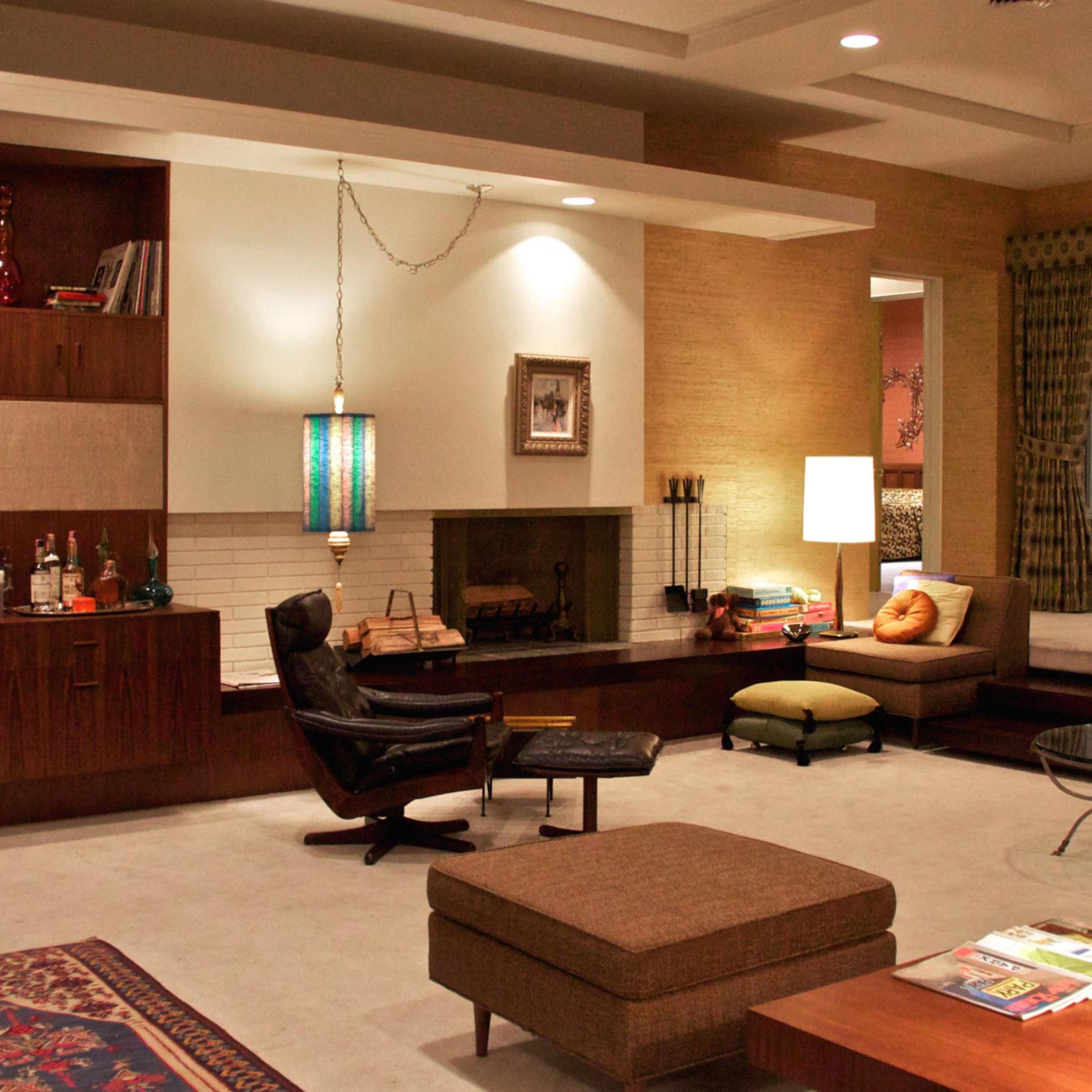 <b>Draper apartment</b> (1966, inspired by Frank Lloyd Wright): "Don's moving from suburbia—from classical and neoclassical architecture to modern...The sunken living room creates a more dynamic space for the actors. Sometimes they have to step over furniture to get into that lower level. It's fun." —Dan Bishop, set designer