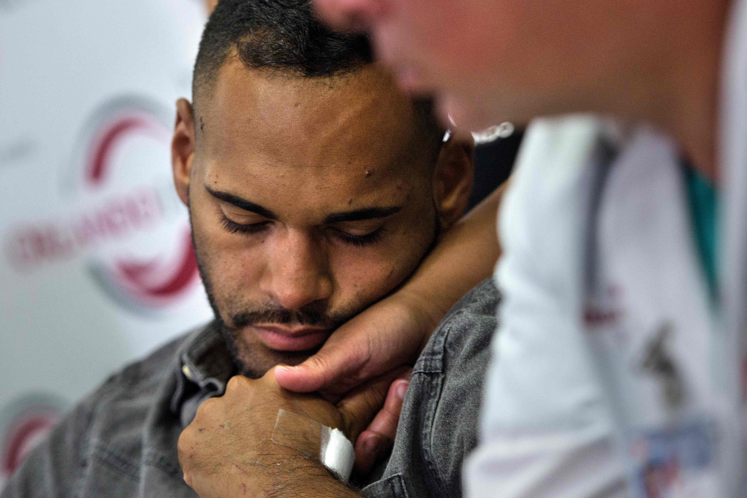 Angel Colon, a survivor of the Pulse nightclub mass shooting, waits to speak during a press conference with Orlando Health trauma staff at Orlando Regional Medical Center in Orlando on June 14, 2016.