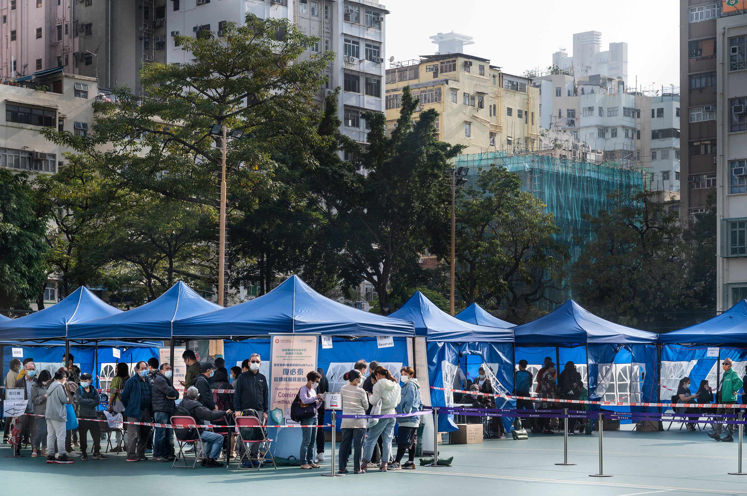 Residents wait to receive a Pfizer-BioNTech COVID-19 vaccine