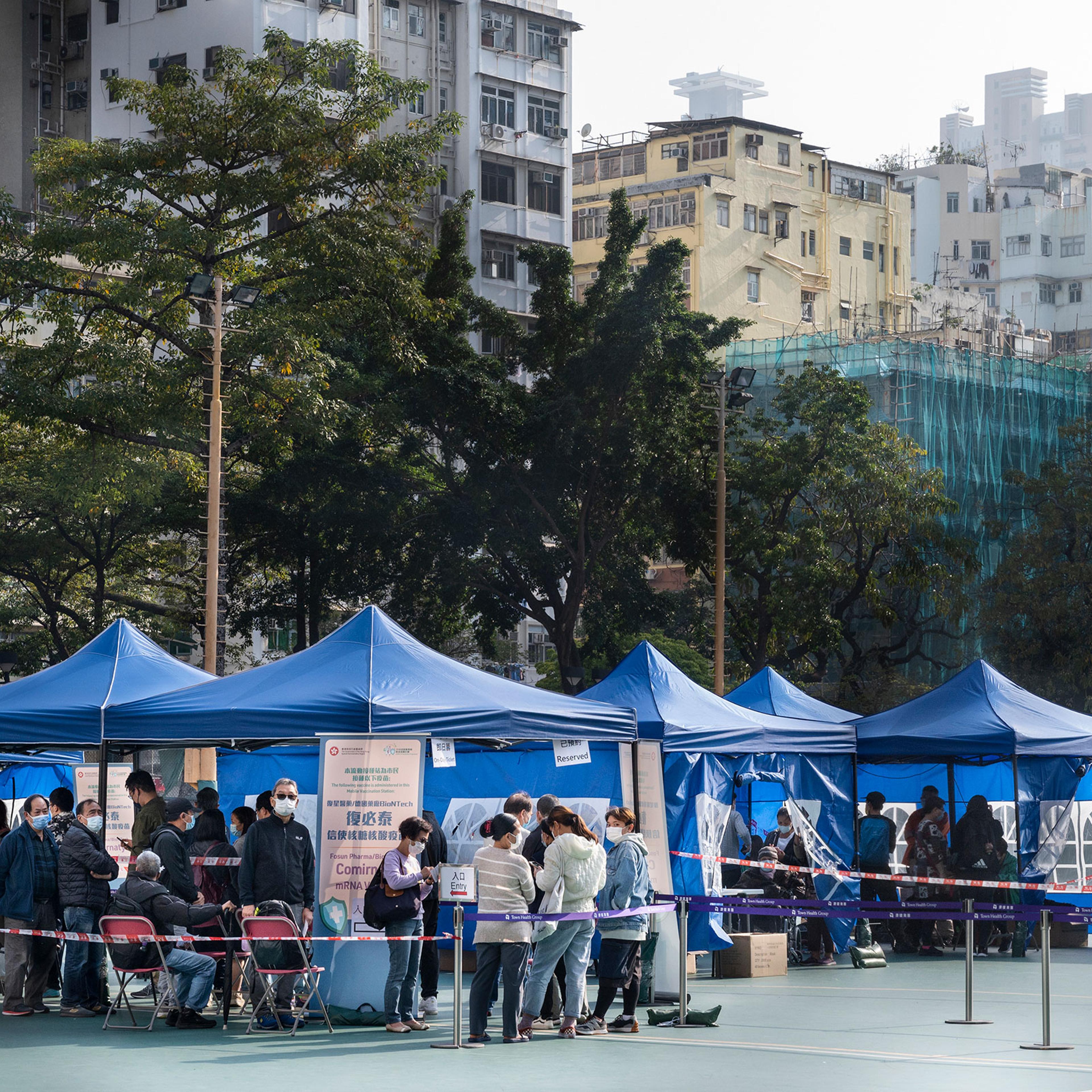 Residents wait to receive a Pfizer-BioNTech COVID-19 vaccine