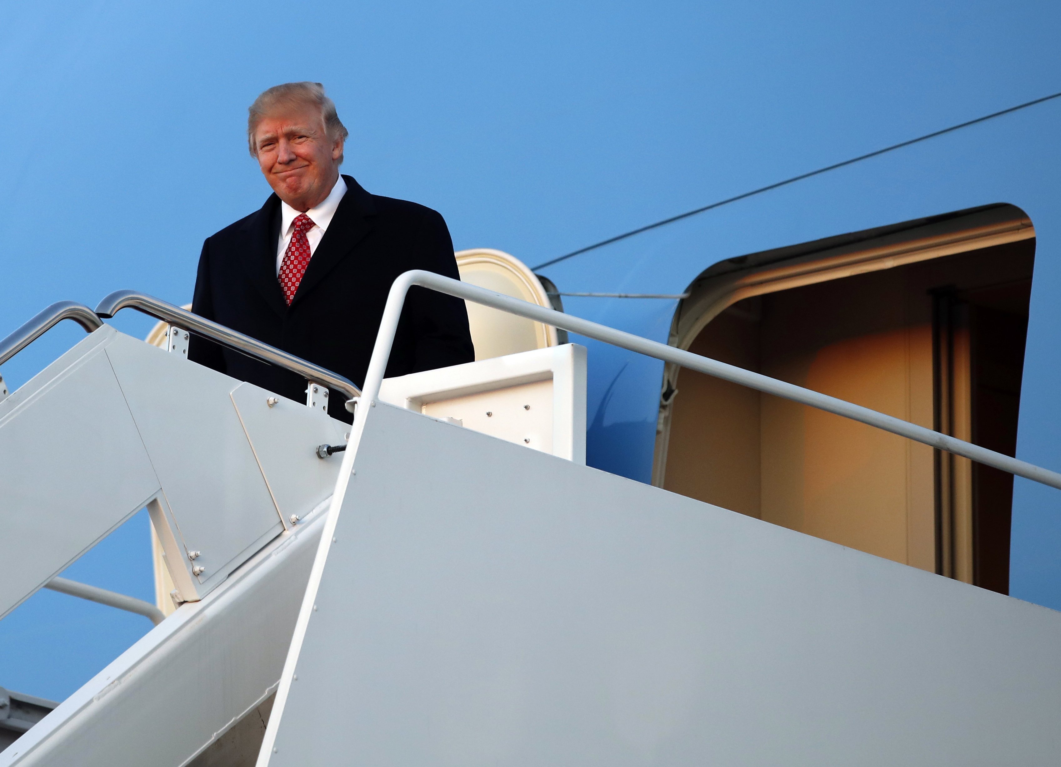 President Donald Trump disembarks Air Force One as he arrives on March 5, 2017, at Andrews Air Force Base, Md.