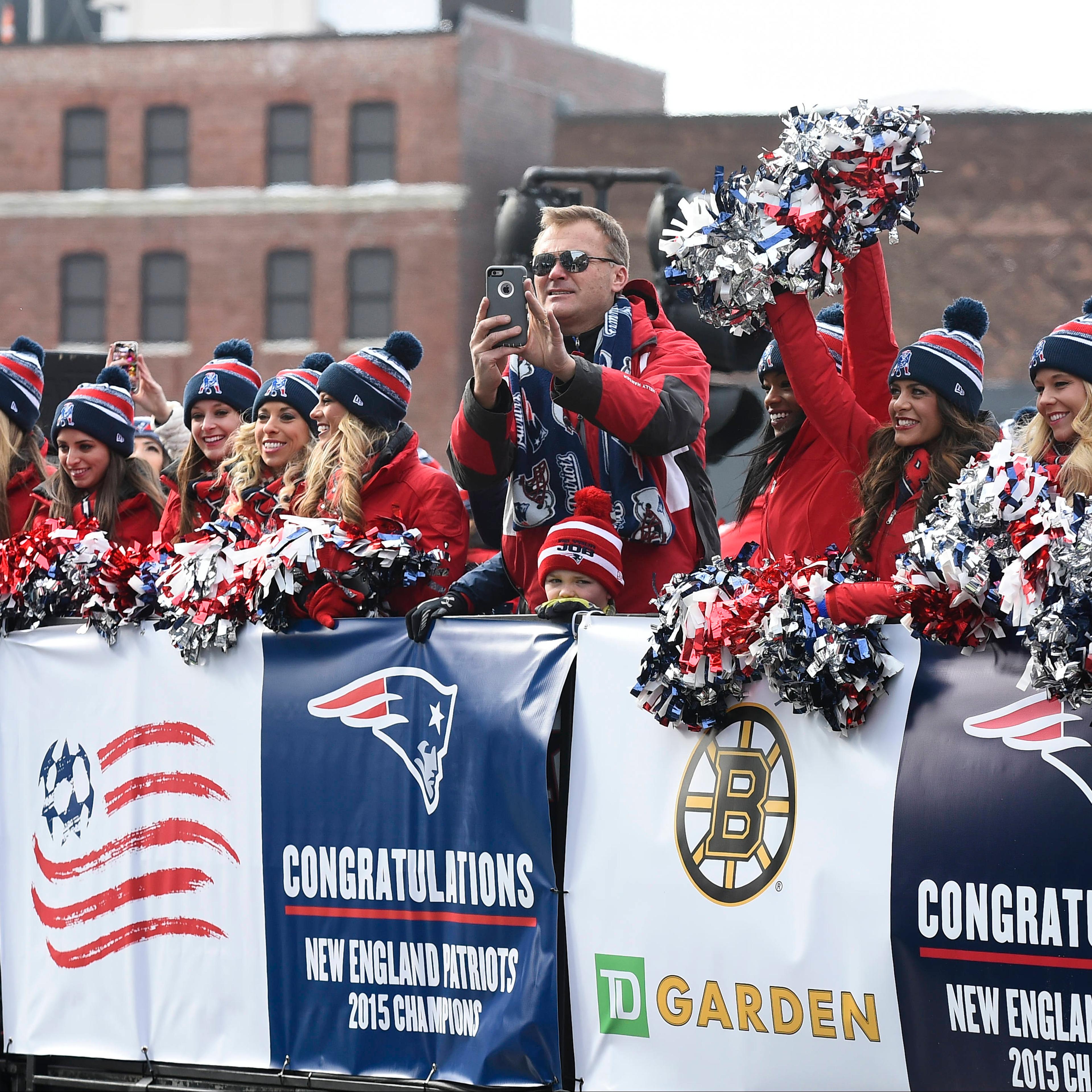 Former New England Patriot Scott Zolack rides with the cheerleaders during a parade held in Boston to celebrate the team's victory over the Seattle Seahawks in Super Bowl XLIX on February 4, 2015.