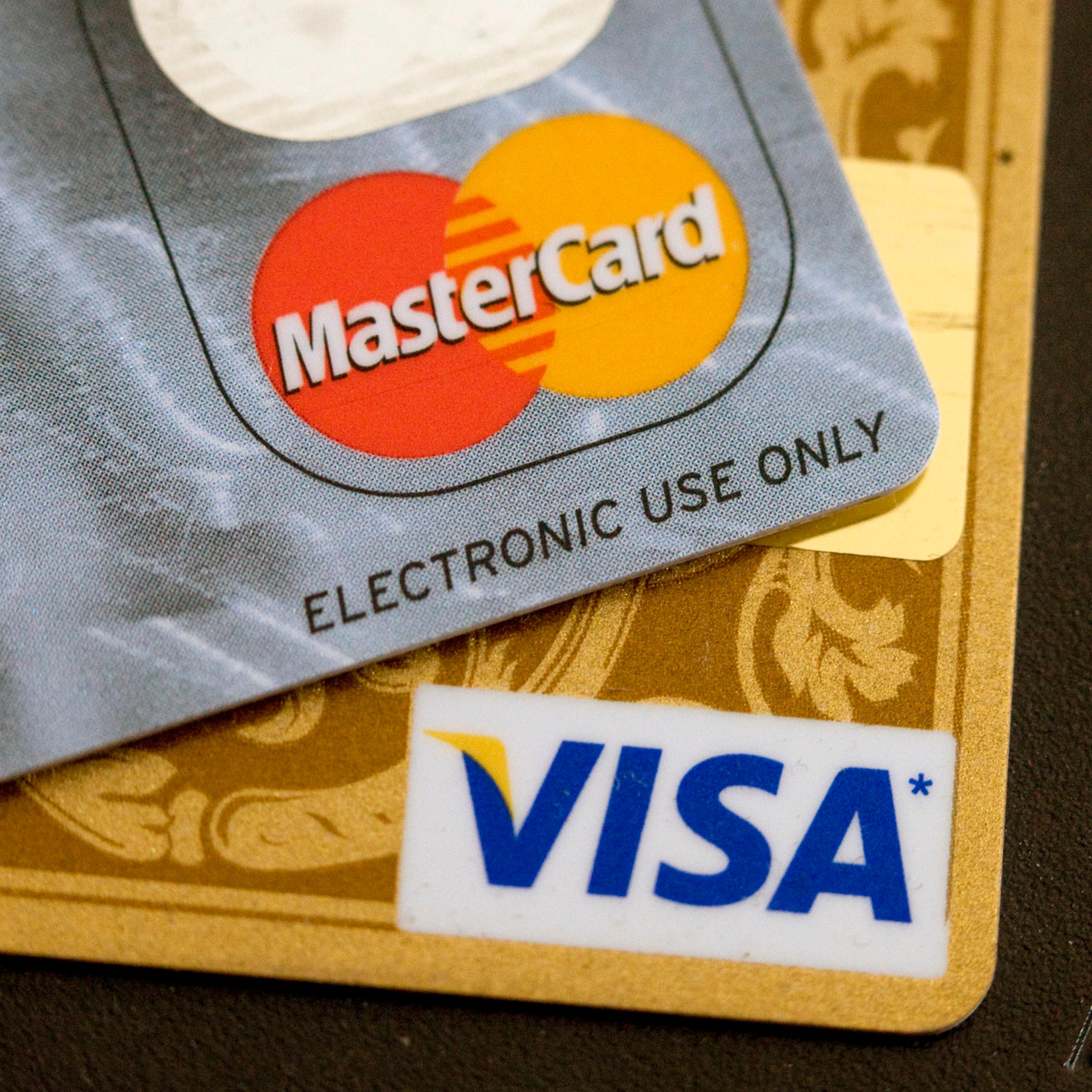 Visa and MasterCard credit cards are arranged for a photo in