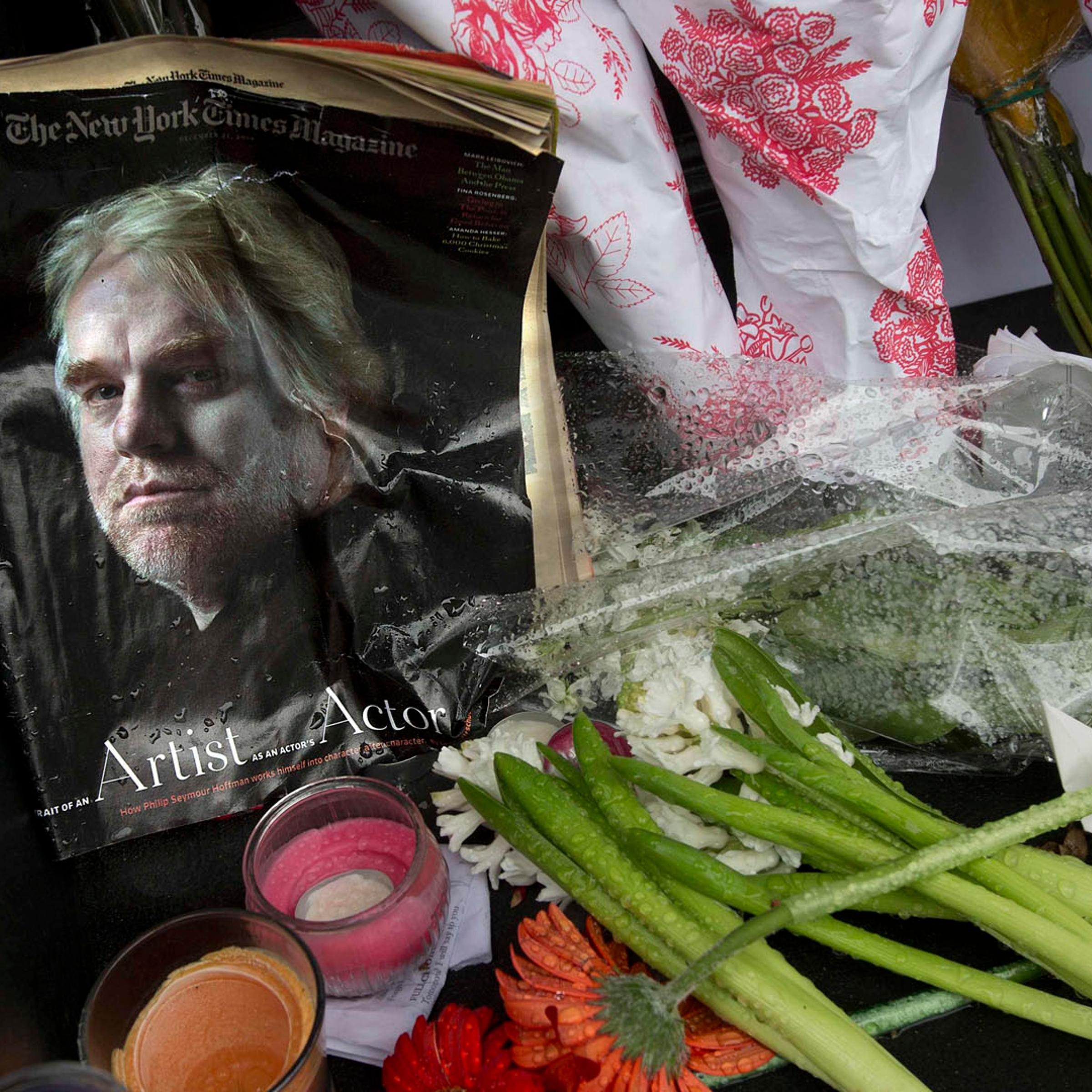 A copy of a New York Times Magazine with a photo of movie actor Philip Seymour Hoffman on the cover in a memorial in front of his apartment building in New York City, on Feb. 3, 2014.