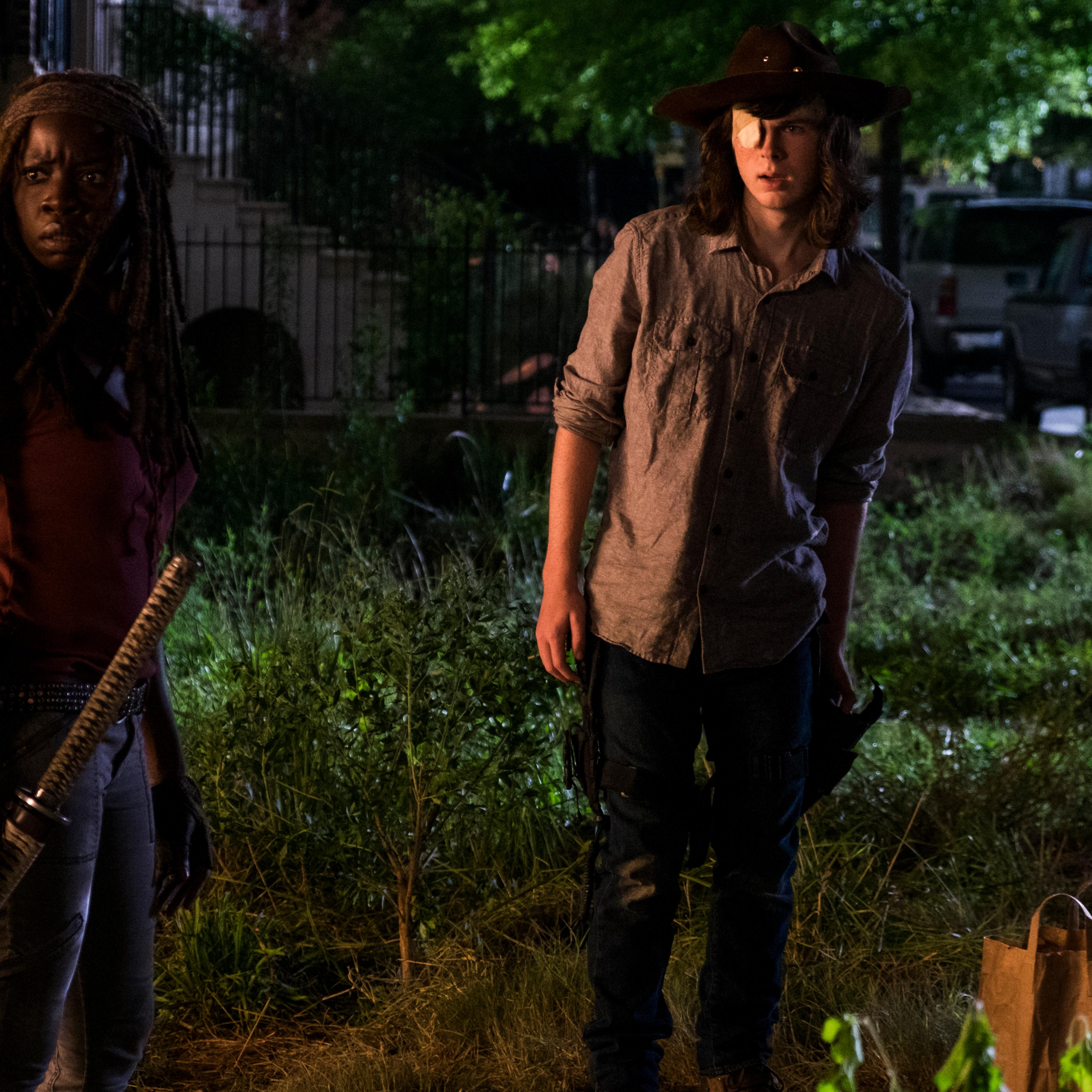 Chandler Riggs as Carl Grimes and Danai Gurira as Michonne in The Walking Dead Season 8, Episode 8