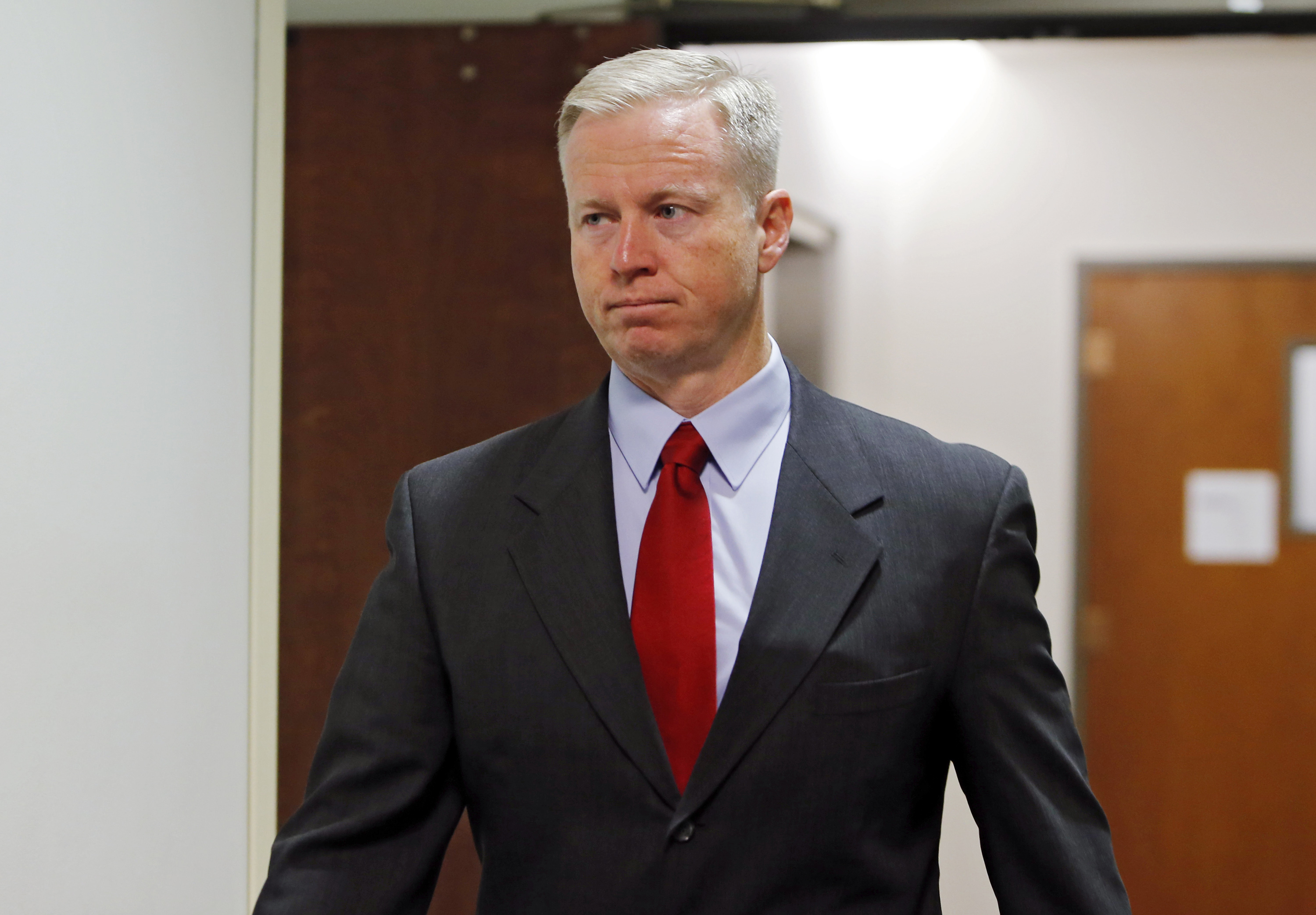 18th Judicial District Attorney George Brauchler arrives for a hearing for Aurora theater shooting suspect James Holmes at district court in Centennial, Colo. on Sept. 30, 2013.