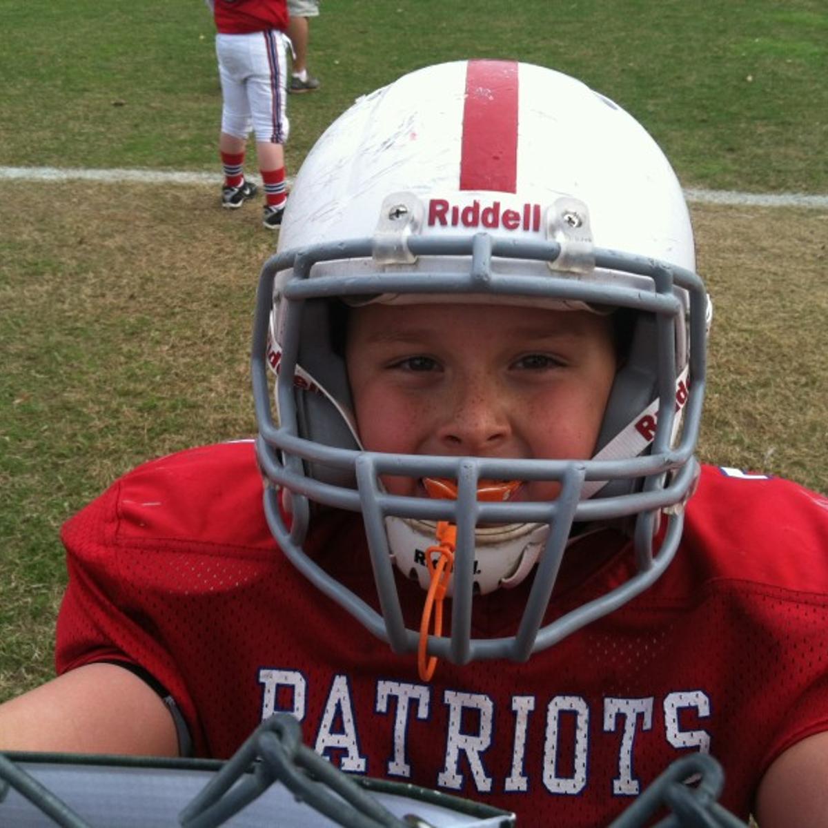 The author's 9-year-old son in his football gear