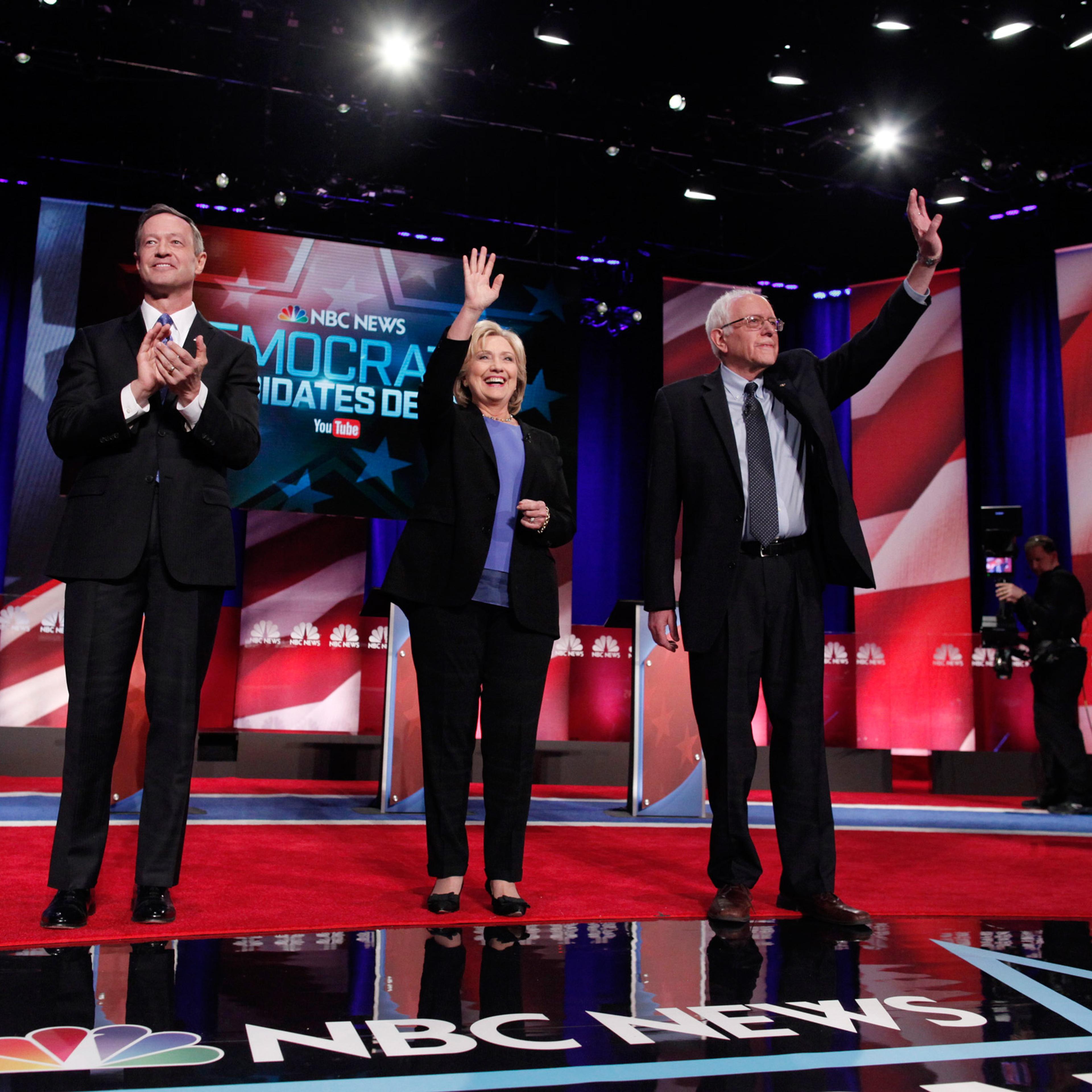 Democratic U.S. presidential candidates (L-R) former Governor Martin O'Malley, former Secretary of State Hillary Clinton and Senator Bernie Sanders pose together before the start of the NBC News - YouTube Democratic presidential candidates debate in Char