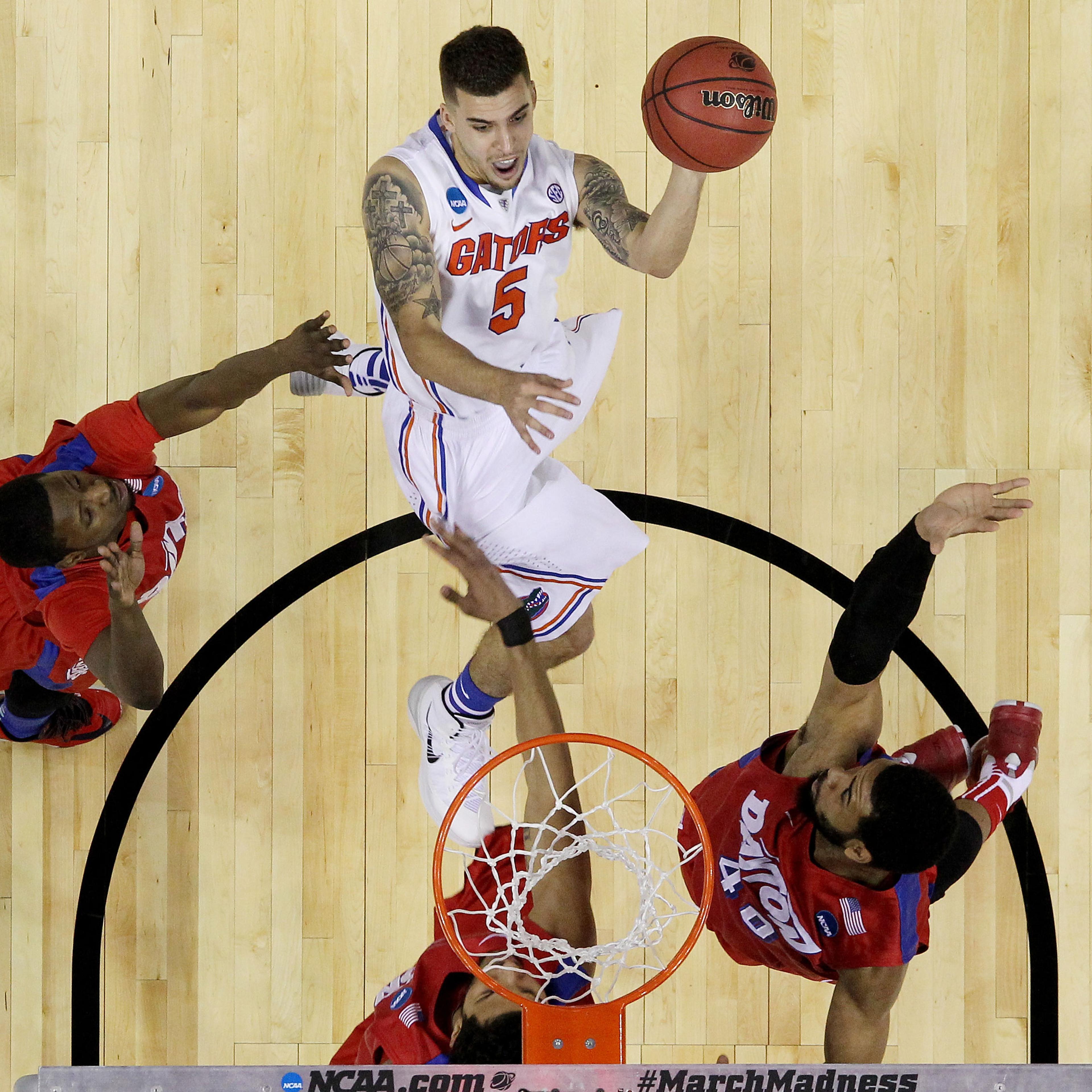 Scottie Wilbekin of the Florida Gators scores against the Dayton Flyers during the Elite 8
