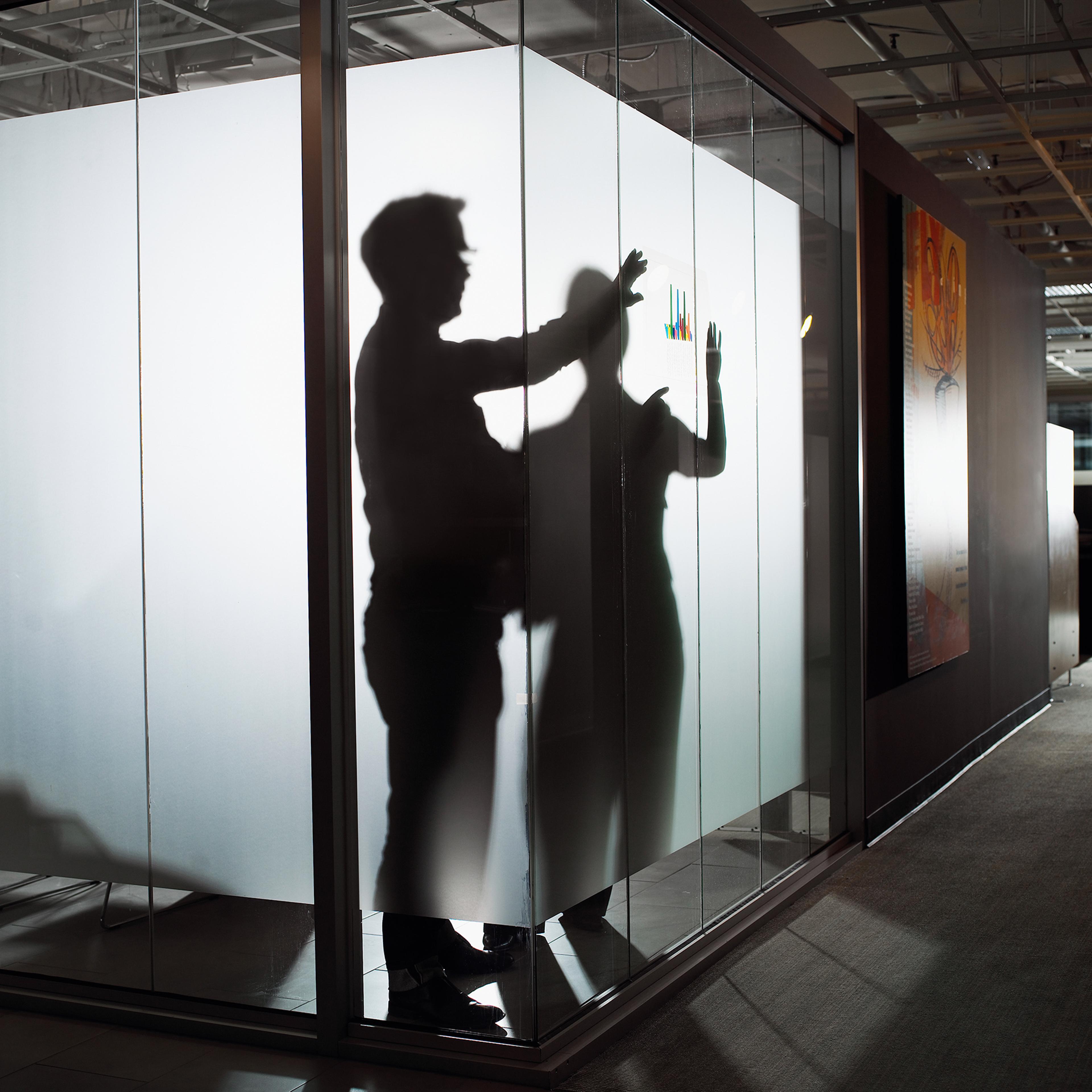 Silhouette of businessman and woman