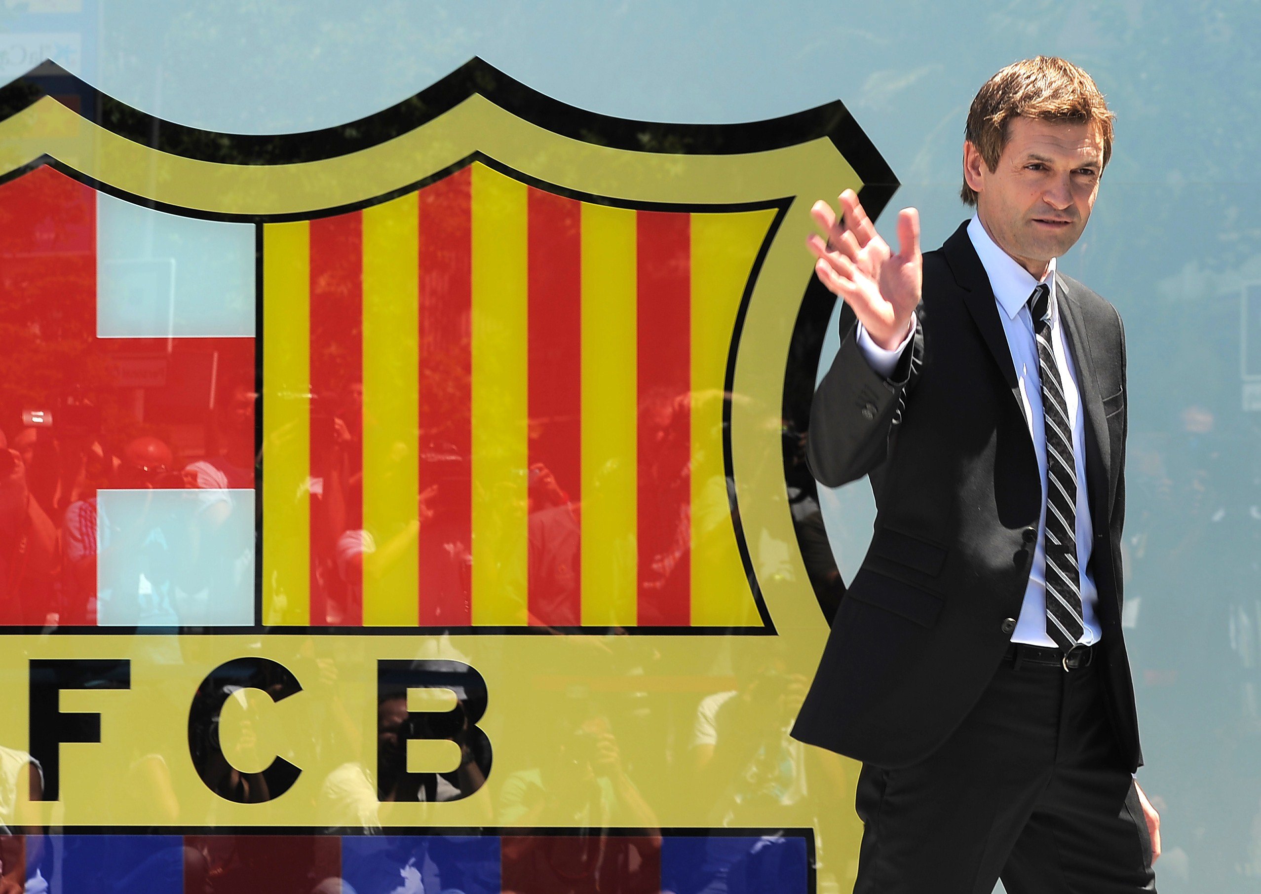 Former FC Barcelona football coach Tito Vilanova waving after signing his contract during a presentation at the Camp Nou in Barcelona.