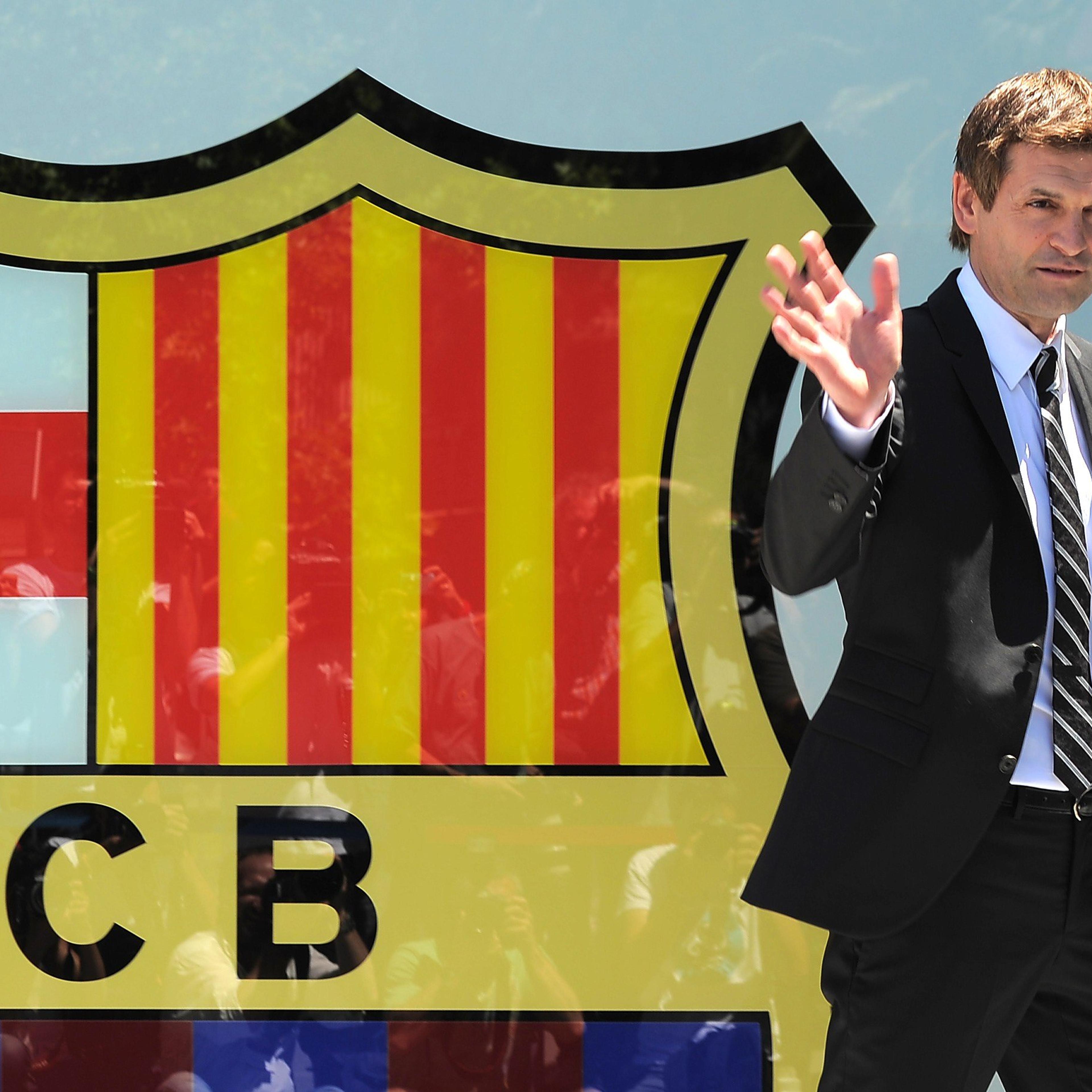 Former FC Barcelona football coach Tito Vilanova waving after signing his contract during a presentation at the Camp Nou in Barcelona.