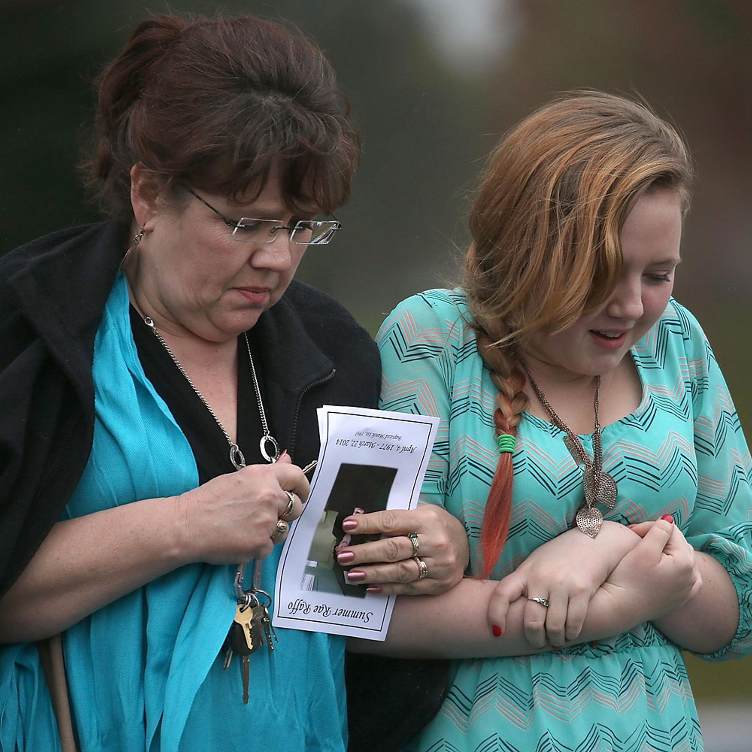 People leave a funeral service for thirty six year-old Summer Raffo, who was killed in the deadly Oso, Washington mudslide, at the Gleneagle Golf Course on April 5, 2014 in Arlington, Wash.