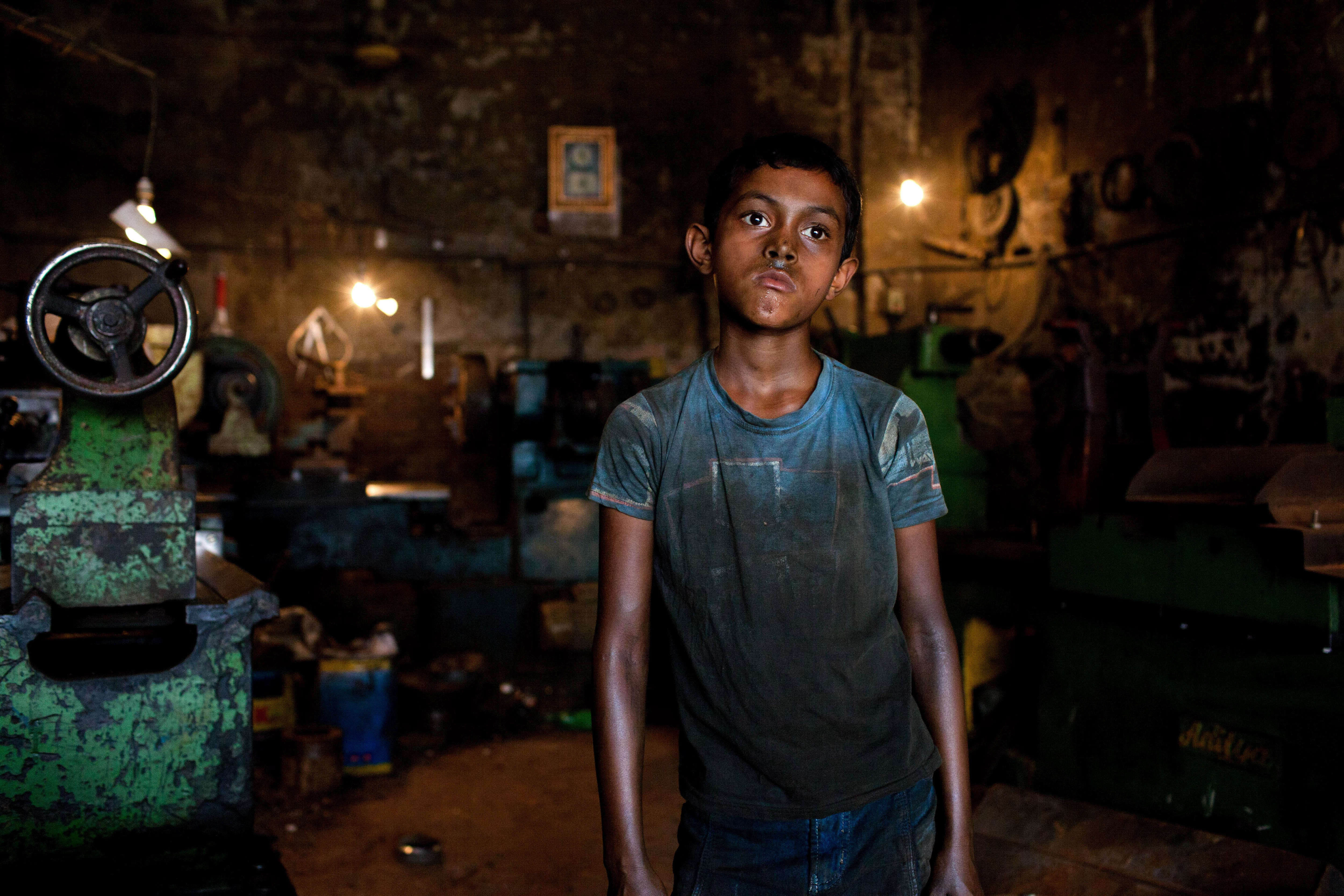 Rakib works in a parts making shop in Dhaka, Bangladesh June