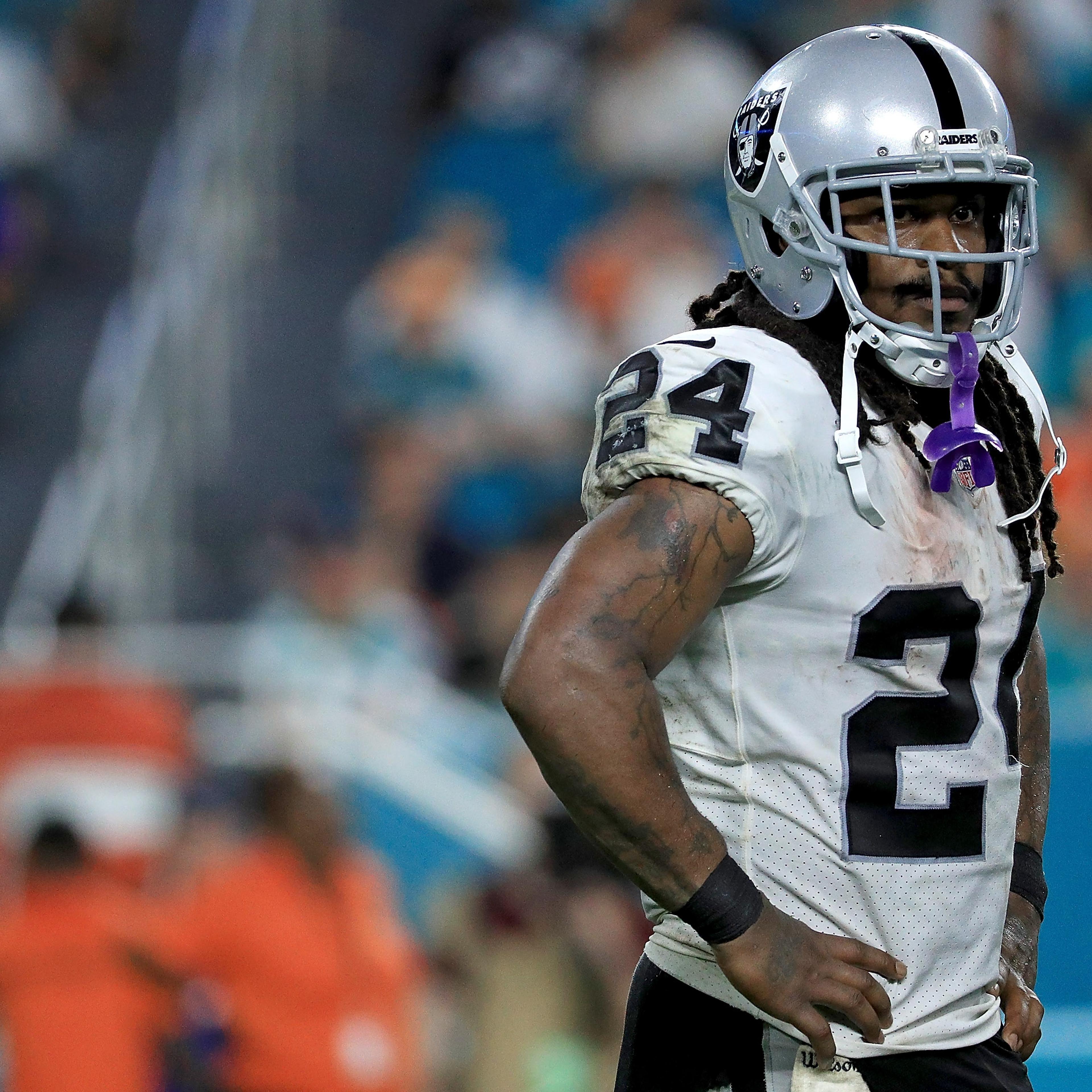 Marshawn Lynch #24 of the Oakland Raiders looks on during a game against the Miami Dolphins at Hard Rock Stadium on November 5, 2017 in Miami Gardens, Florida.