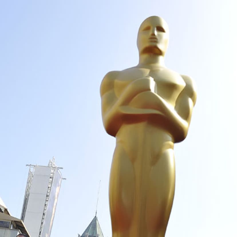 An Oscar statue stands on the red carpet