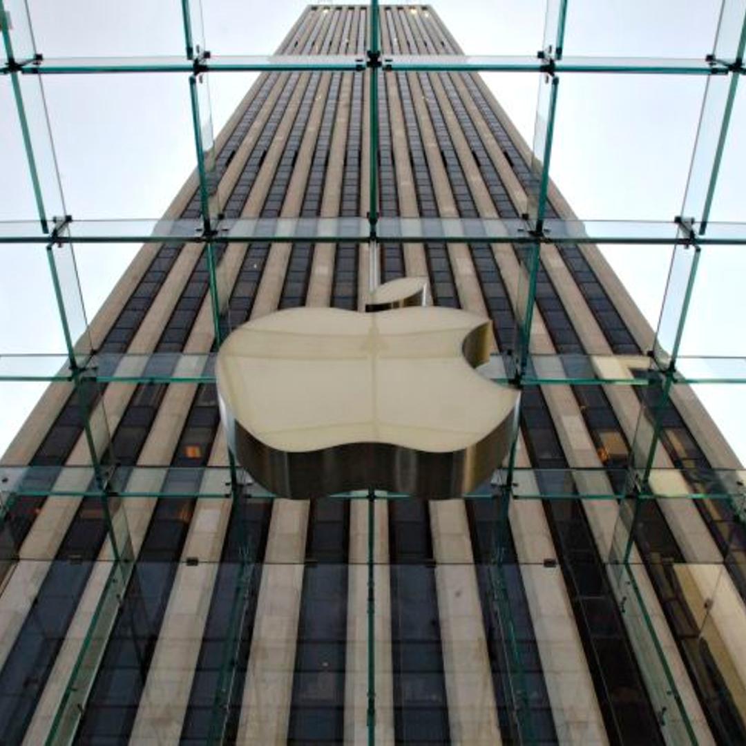 An Apple Computer Inc. logo hangs in the center of a clear g