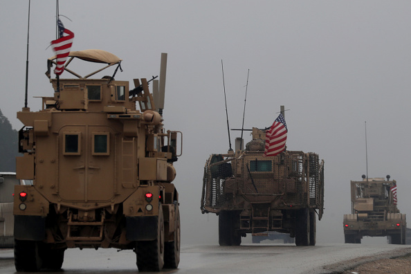 A picture taken on December 30, 2018, shows a line of US military vehicles in Syria's northern city of Manbij. - President Donald Trump announced last week that US troops would depart from Syria, leaving Manbij residents dreading a long-threatened attack