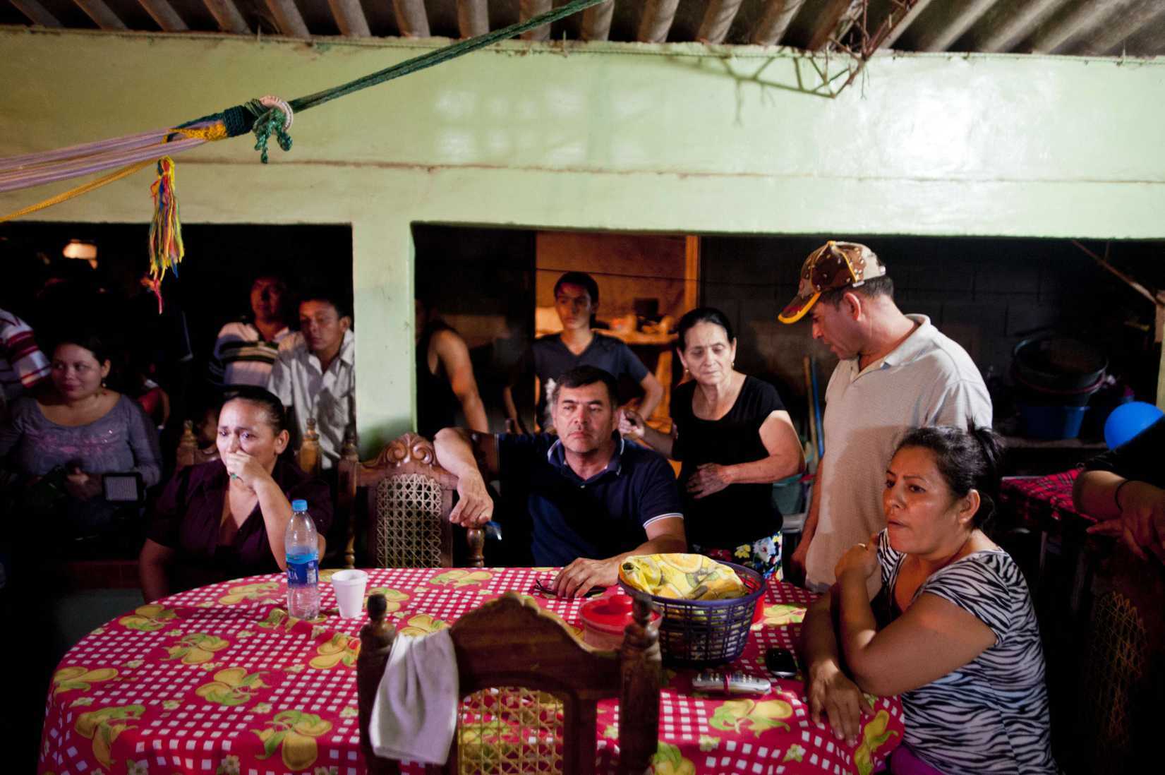 Pacific castaway Jose Salvador Alvarenga's family watch the broadcast of his arrival at their house in Garita Palmera 118 km. west from San Salvador, El Salvador, on February 11, 2014.