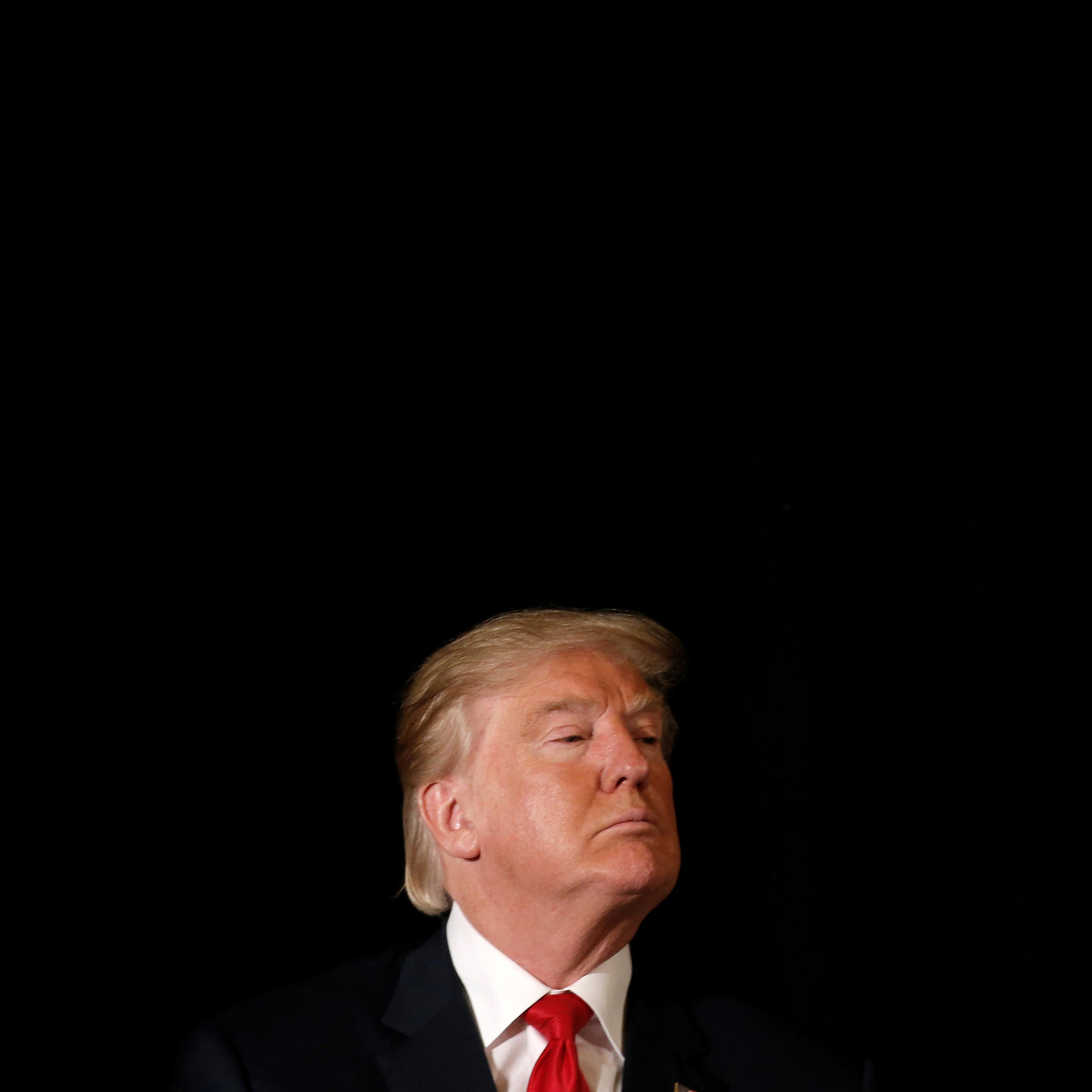 Republican presidential nominee Donald Trump listens to a question as he appears at the "Retired American Warriors" conference during a campaign stop in Herndon, Virginia, U.S., October 3, 2016. REUTERS/Mike Segar - RTSQKJJ