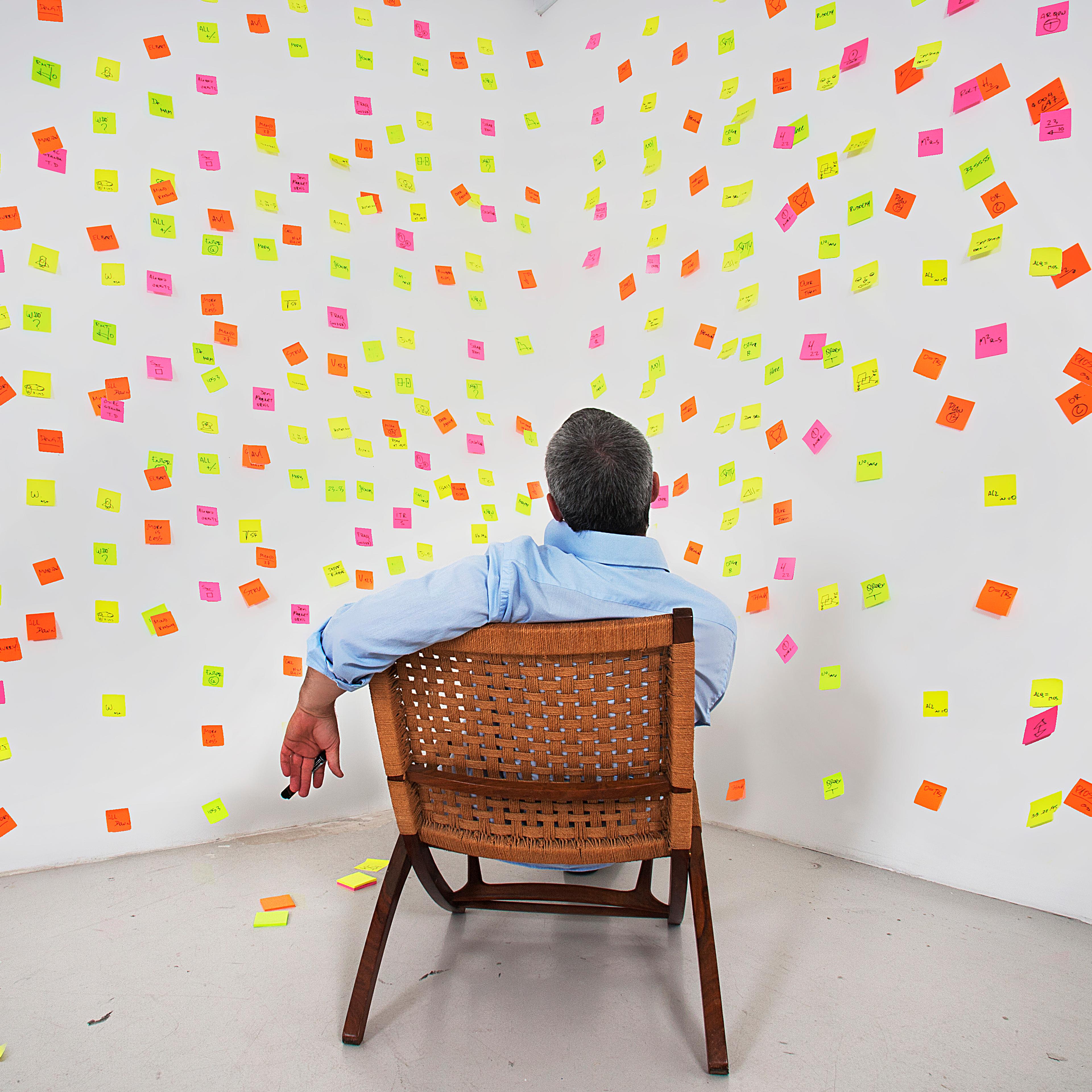 man-sitting-sticky-notes