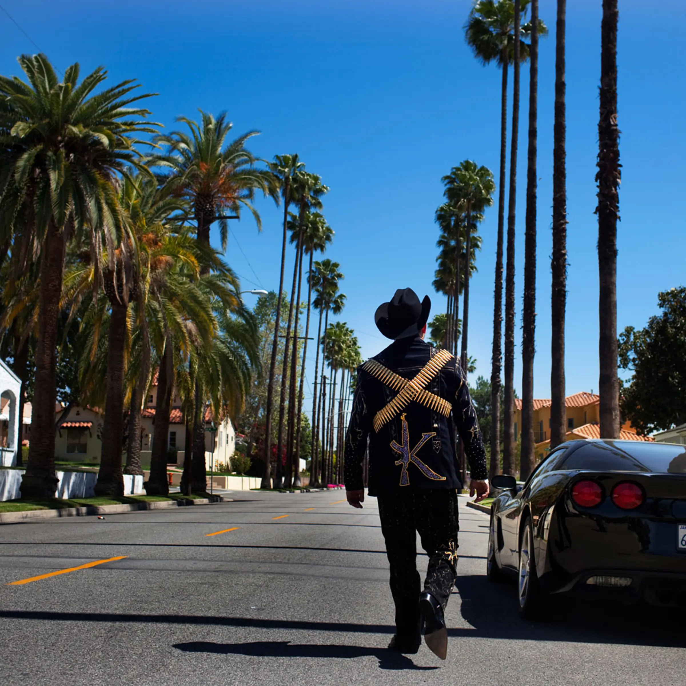 <b>El Komander</b><br>
Alfredo "El Komander" Rios walks down a street in Burbank, Calif., near the office of his agent and producer, Twiins Enterprises. One of the hottest <i>narcocorrido</i> talents in the industry, El Komander regularly performs at private parties for Sinaloa's cartel members and composes songs for and about them