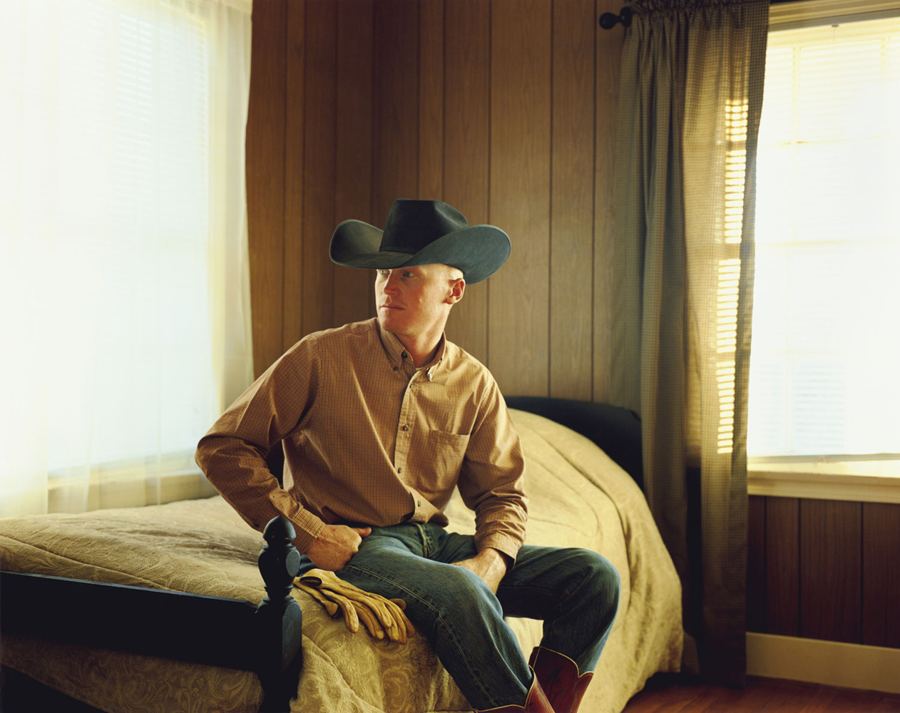 Ron Redford, Cowboy, Benjamin, Texas 2009
<br><br>
Ron stores his leather gloves, which are covered in numbers, around his belt buckle.