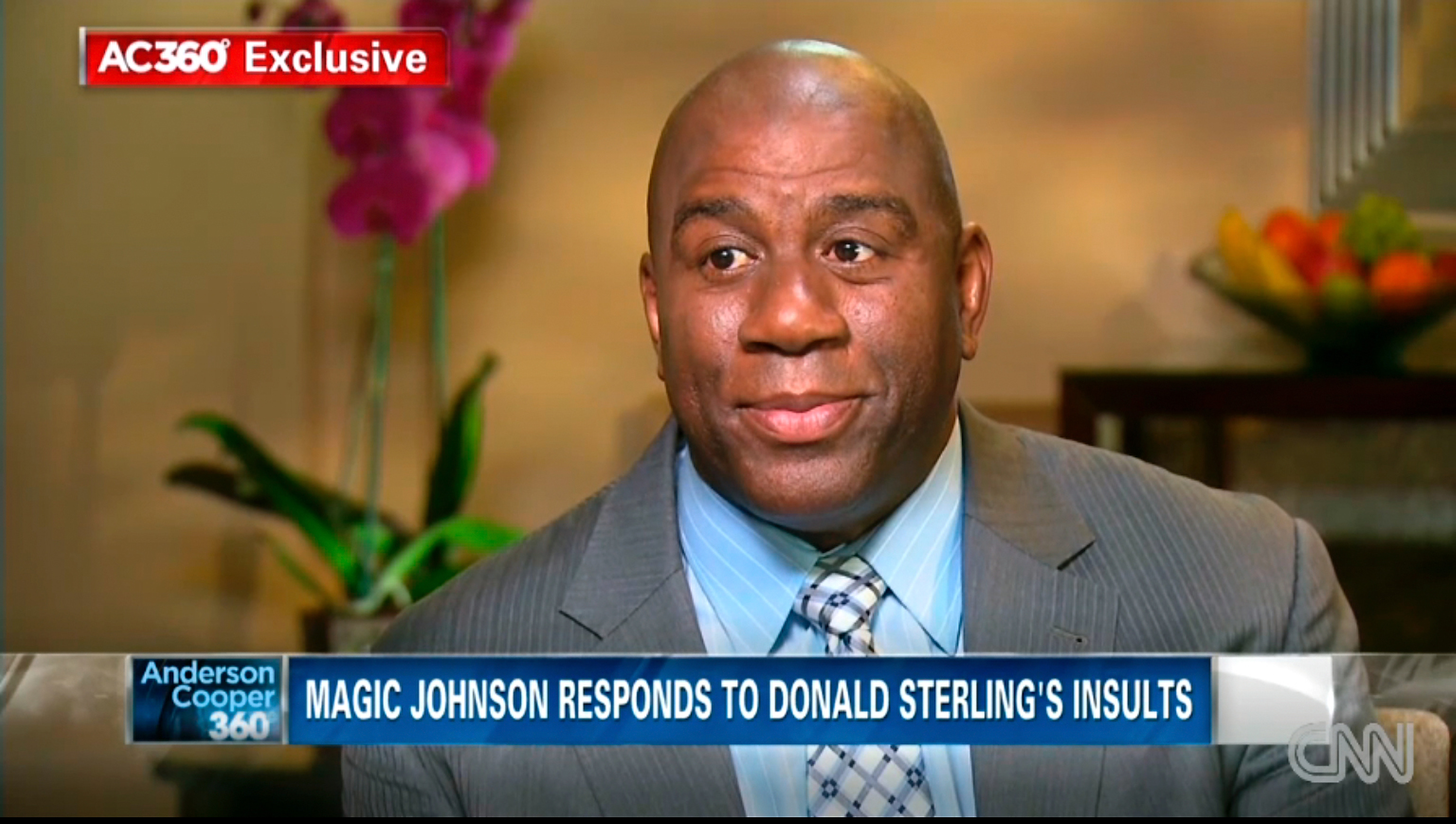 In this image taken from video provided by CNN, Magic Johnson talks with host Anderson Cooper at studios in Los Angeles in an interview broadcast on May 13, 2014.